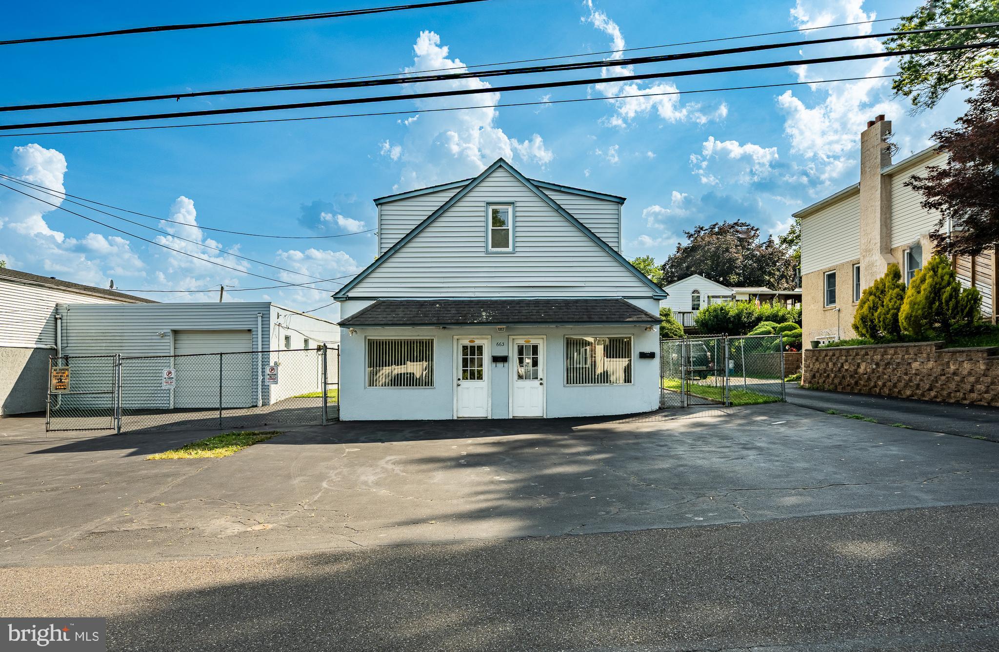 This freestanding building offers more than 650 sq. ft. of first-floor space, ideal for professional office use. The layout can be customized to meet a variety of business needs, offering excellent flexibility. The property includes an 1100 sq. ft garage bay with a separately zoned heating system as well as a 9'8" clearance for extra large truck entry and on-site parking for staff and customers, ensuring convenience and accessibility. Upstairs, the second floor features an approximately 650 sq. ft. residential apartment with 2 bedrooms, 1 full bath, a kitchen and living area. The exterior features a nicely fenced-in yard, offering added privacy and outdoor space. Located in the highly regarded Neshaminy School District, this property presents a prime opportunity for both business owner-occupants and investors. Buyers are strongly encouraged to contact the township to verify permitted uses.