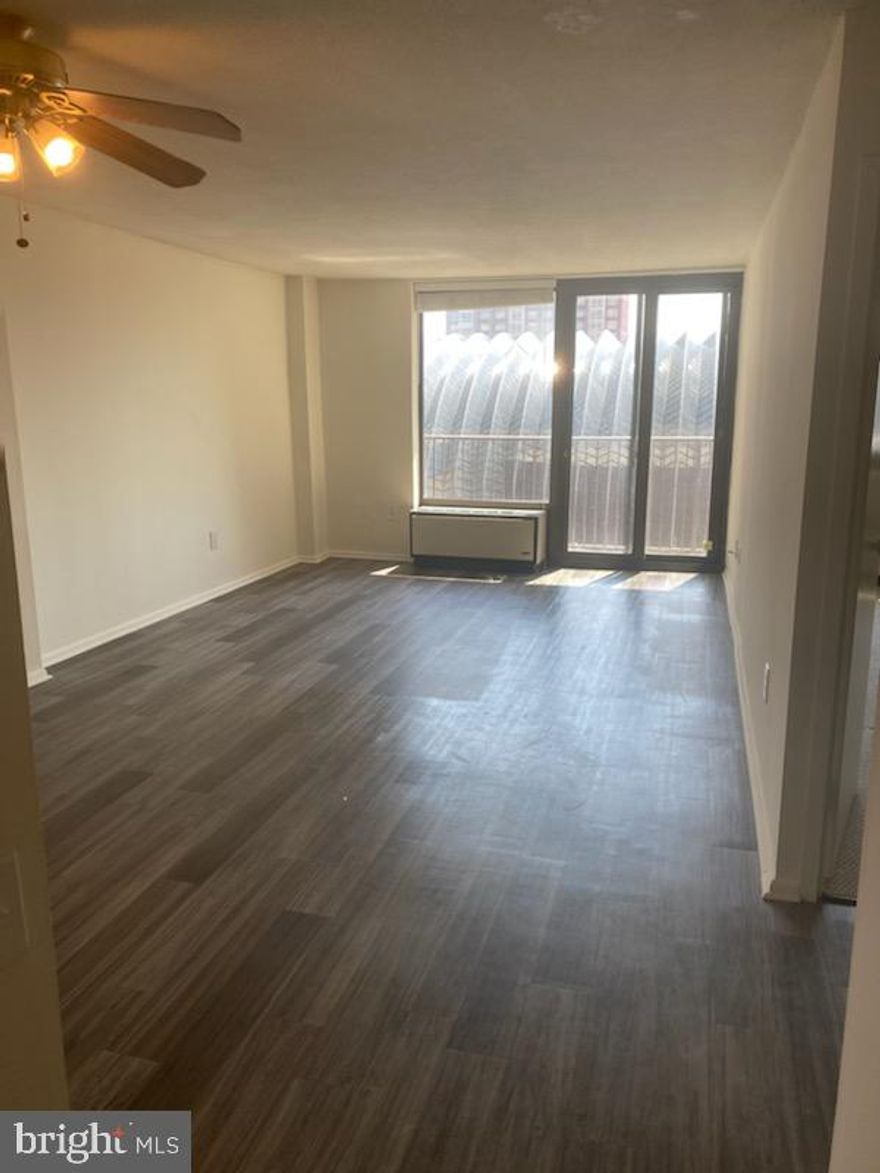 Updated corner one bedroom with Juliet balcony boasting southern city views at Academy House! This home has a generously sized living and dining room with new gray wood-like floors and access to the Juliet balcony. There is a large kitchen with white shaker cabinetry, upgraded countertops and stainless steel appliances. The bathroom has a shower/tub, updated vanity, linen closet, and washer/dryer. There is excellent storage space throughout. Academy House enjoys a coveted Avenue of the Arts address, located three blocks from Rittenhouse Square and close to public transportation. Residents enjoy a brand new indoor pool and state-of-the-art fitness center as well as the option of valet parking, and a 24-hour doorman.