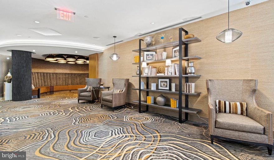 Nestled in the vibrant heart of Bethesda, Maryland, this luxury apartment complex offers an unparalleled living experience that combines modern convenience with sophisticated design. Designed to cater to the discerning tastes of urban dwellers, this property stands as a testament to luxury living, where every detail has been meticulously crafted to ensure the utmost in comfort and style.

*Exceptional Location*
Located in the sought-after Woodmont district, the apartment complex is perfectly positioned as a gateway to the best that Bethesda has to offer. Residents enjoy easy access to a plethora of amenities, including the Walter Reed National Military Medical Center, the NIH, and a variety of shopping, dining, and entertainment options. The prime location also offers convenient access to public transportation, making it easy to explore the wider metropolitan area.

*Architectural Elegance and Design*
The building's U-shaped design opens up to a beautifully landscaped courtyard, offering a seamless transition from the bustling city life to a tranquil oasis. The architecture is both richly textured and humanly scaled, creating an inviting streetscape that residents are proud to call home. A dramatic window wall façade and ground-level duplex units with front porches and planters further enhance the building's aesthetic appeal.

*Luxurious Amenities*
Residents of this apartment complex enjoy access to an array of exceptional amenities designed to enhance their lifestyle. The property boasts a large fitness center, fireside lounges, and a rooftop lounge equipped with bars, fireplaces, grilling areas, and two pools. Additionally, the convenience of having a 50,000 square foot grocery store within the building cannot be overstated. The property is also LEED Gold Certified, reflecting a commitment to environmental sustainability.

*Sophisticated Living Spaces*
The apartments themselves are a reflection of the luxury and sophistication that define the property. With a variety of floor plans, including studios, one to three-bedroom apartments, and townhomes, there is something to suit every preference. Each unit features designer finishes, stainless steel appliances, and spacious layouts that make coming home a pleasure.

*Community and Convenience*
The property is known for its friendly and helpful staff, ensuring that the needs of residents are met with professionalism and care. The well-maintained common areas and the sense of community fostered among residents make this complex more than just a place to live—it's a place to belong.

This luxury apartment complex in Bethesda, Maryland, offers an unmatched living experience for those seeking the best in urban living. With its prime location, architectural elegance, luxurious amenities, and sophisticated living spaces, it stands as a beacon of modern luxury and convenience. Realtors and renters looking for a property that combines the vibrancy of city life with the comfort of upscale living will find everything they desire and more at this premier apartment complex.

** Pricing and availability subject to change on a daily basis ** Photos are of model units ** Parking may be available for additional fee **