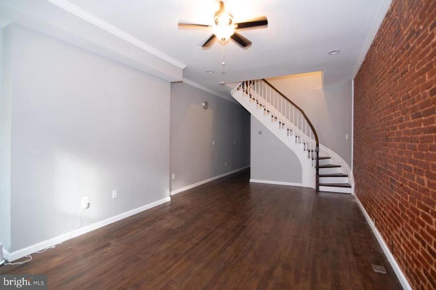 Welcome to this charming home located in the sought-after Heritage Crossing neighborhood of Baltimore City, offering a spacious 1,830+/- square feet of living space. This well-maintained property boasts 5 generously sized bedrooms and 2.5 bathrooms, providing ample room for comfortable living.

As you enter the main level, you are greeted by a bright and inviting living room that flows seamlessly into the dining room, perfect for entertaining guests or enjoying family meals. The kitchen is well-appointed with modern finishes and features easy access to a private balcony, ideal for relaxing or outdoor dining. A convenient half bathroom is also located on this level, enhancing the functionality of the home.

The second level of the home is home to 3 bedrooms, each offering plenty of natural light and closet space, along with a full bathroom equipped with updated fixtures. The third level features 2 additional bedrooms and another full bathroom, providing flexible living options for families, guests, or home office needs.

The lower level is partially finished, offering additional living space for a variety of uses. This level includes a storage area and a utility room with the washer and dryer, ensuring both convenience and practicality.

This home is ideally located in a vibrant and growing community, close to local amenities, schools, parks, and major transportation routes, making it an excellent choice for those seeking both comfort and convenience in Baltimore City.