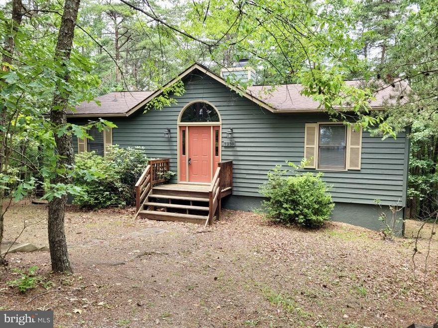 Call it a Cabin, Cottage, Raised Rambler, you will love this two-level home with Windows Galore in the Bryce Mountain community. Beautiful, treed views in the Summer turn to Mountain views in the Winter. This residence offers over 2000 square feet of finished space with the perfect blend of cozy intimacy and ample room to stretch out. Step inside to discover a spacious living room and bonus room with two-sided wood burning fireplace, bathed in natural light and ideal for both relaxation and entertaining. The heart of the home lies in its spacious kitchen and formal dining area, where culinary adventures await, and memories are made over delicious meals. The sunny and spacious Primary Suite is on the main level and includes a large walk-in closet and Primary Bath with tub/shower. Your guests will enjoy two private bedrooms on the lower level with full bath. Double sliders flood the adjoining Family Room with sunlight. Recent updates include a new furnace and water heater in 2022, Roof replaced in 2011. As the day winds down, step out onto your private back deck and unwind in the soothing embrace of the treetops sighing in the breeze. Whether it's stargazing under the vast night sky or simply basking in the tranquility of nature, this outdoor oasis promises moments of pure bliss. With access to resort amenities (Chalet High Activity Center and Pool, Copper Kettle Restaurant) 4 minutes away and Golf Course 1 mile, every day feels like a vacation in this idyllic retreat. Grocery store (Orkney Grade) and Farmers' Market (Wednesdays) just 5 minutes away. Don't miss your chance to make this dream home yours and experience the best of Bryce living!