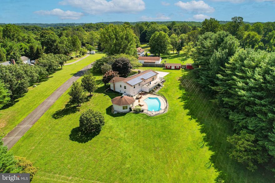 Welcome to this stunning ranch-style home nestled on a lovely lot, boasting alluring amenities including a refreshing pool! This five-bedroom, four-bath residence showcases a perfect blend of timeless elegance and modern comforts. Step inside this excellent condition home and be greeted by an abundance of natural light that fills the spacious living areas. The heart of the home lies in its fully updated kitchen, where sleek countertops, high-end appliances, and ample storage space await your culinary adventures. The adjoining eat-in area offers a seamless flow for entertaining guests or enjoying family meals. Retreat to the inviting bedrooms, each thoughtfully designed to provide comfort and relaxation. The four pristine baths feature luxurious fixtures and finishes.  Aside from its impeccable interiors, this home also features the added benefit of solar panels, enhancing energy efficiency and reducing utility costs. Embrace sustainable living with this eco-friendly upgrade. Step outside and discover a backyard oasis, complete with a sparkling pool and pool house together providing for a perfect area for hosting summer gatherings.  The well-maintained lot offers endless possibilities for outdoor recreation and entertainment. Positioned in a highly desirable location, this property ensures convenience with its proximity to local amenities, shopping districts, and reputable schools. Experience fine living in this exceptional home where modern comforts and a tranquil setting seamlessly intertwine.

Updates include:  within the last 3-5 years, the furnace, hot water heater, new front door, main bedroom windows and 1 other bedroom updated windows.  
Total new main bath and professionally organized main closet.
Pool was completely renovated to include salt cell (salt cell saves on expenses for the pool)