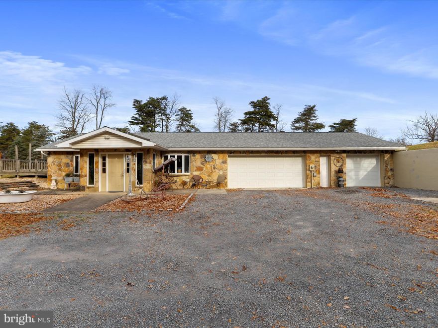 This all one level home features 4 bedrooms, 2 full bathrooms, 2 living spaces, kitchen, dining area, laundry and a 3 car attached garage. But that's not all, it has gorgeous views, 2 minutes from Fort Ashby's stores/restaurants, but you feel like you are in the middle of nowhere! 1.56 acres on a dead end street that offers privacy & peacefulness! There is also an inground heated pool. The forced air, hot water and pool are all heated by the outdoor woodstove! So efficient!