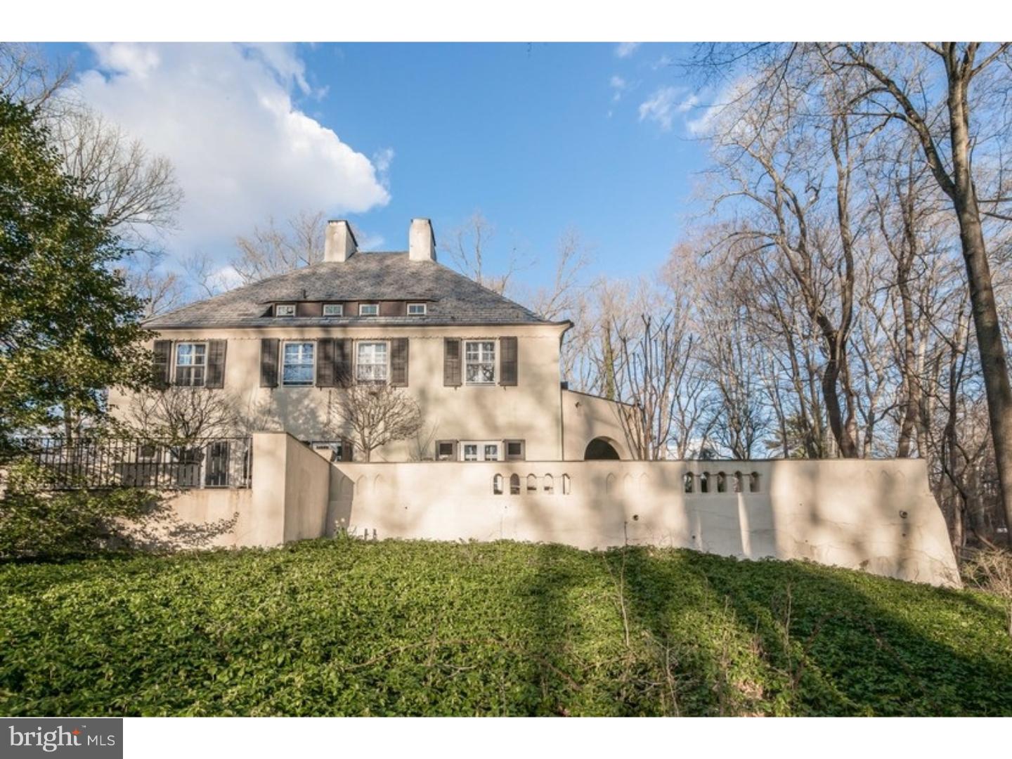 Sophisticated yet charming, this architectural gem is located in the heart of the Main Line within walking distance to Suburban Square. Custom built in circa 1925, this extraordinary European home designed by and built for architect John Irwin Bright and his family, is embraced by beautiful slate terraces and custom designed gardens. Bright was inspired by his travels to Morocco, and his time in Paris. The home was completely renovated with style and grace using the finest materials by the present owner. Massive Brazilin mahogany doors open to the impressive foyer with slate floors, a Fire Place and built-in book shelves. The enchanting fireside Living Room, with exposed beams and terra cotta tile floors, is surrounded by 3 original iron French doors that open to the covered slate terrace that surrounds the home, The wonderful Dining Room with fireplace is perfect for formal dining. The Kitchen was just completely renovated with top of the line appliances, leathered noir granite counters and terra cotta floors. A Franklin stove accents the Breakfast Room. The main staircase to the 2nd floor has poured concrete steps with Mercer tile risers. A romantic Master Suite with: a full bath, state of the art built - in cabinetry with closets and TV area, and a fireplace, has access to the terrace thru charming French doors that overlook the grounds. Two additional (both with FP) Bedrooms and a hall Bath plus a Den with fireplace complete this level. The third level features 3 more Bedrooms, a large walk-in closet/storage room, and a full Bath. This house was constructed of solid poured concrete with a Vermont slate roof. All of the windows are metal casing with storms and screens. The interior and exterior have been freshly painted. Cherry Lane offers the best of both town and country with easy access to all major transportation routes and everything that the Main Line has to offer.