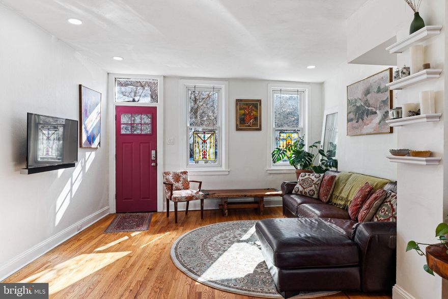 Built in an age when horses galloped on cobblestones, this charming, well maintained 15  x 74' deep home is nestled between 700K/up popular art museum town homes and the wall of the historic Eastern State Penitentiary which in this 21st century can be utilized for lots of great parking.  Enter through the front door into sunny eclectic spaces that flow from one room to the next, open design living/dining area  and refinished honey colored, hardwood floors throughout.  Step into Kitchen  with stainless appliances, handsome oak cabinetry,  ceramic tiled floor overlooking extensive lush garden with pergola and plenty of room for gardening and entertaining.  Head upstairs to second floor which features 3 bedrooms. Primary bedroom with new Anderson windows shows a view filled with pink flowers  from branches of outside blossom tree, a second room that might be office and third bedroom, both have a view of  the garden.  Bathroom has a skylight, victorian patterned floor tile, vessel basin sink and aqua swing glass shower door.  Generous storage in basement along with washer/dryer.  Playground half a block away now doubling as outdoor seating area for locals and food truck visits from Pitruco Pizza, Taco's and Burgers several nights a week and don't forget the farmers market on Thursdays, plus Whole Foods and Green Street dog park nearby.  Just a short walk into Center City with easy access to public transportation and convenient to Temple, Drexel and Penn Universities.  Enjoy local restaurants or bike, run or walk along Kelly drive and the Schuylkill river towpath.  Homestead allowance can reduce real estate taxes over $1000.  HIGHEST AND BEST OFFERS TO BE SUBMITTED BY 4PM MONDAY, March 24th.