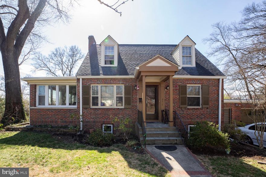 'Note the significant ($25,000)  reduction in price for this charming, brick Cape Cod in  the lovely town of University Park.  It's living in a 'Neighborhood.'   Residents of the Town enjoy top-rated schools, community events, a lovely Town park with shaded walking trails along the creek and (two) age-specific play areas, plua all the amenities of the vibrant Route One Corridor.  

The house blends classic character with modern convenience, featuring gleaming oak floors, a cozy fireplace, and a sun-drenched sunroom—ideal as a home office, playroom, or art studio. The kitchen boasts stainless steel appliances, brand-new range and disposal, and a huge pantry closet.  A convenient main-floor HALF bath adds to the home's functional layout.  (Shower does not work.) 

Upstairs, two bedrooms share a well-appointed bath, while a cleverly converted garage bay offers a separate-entry bedroom—perfect for guests, a home business, or additional living space. The expansive, wood-paneled basement is built for entertaining, complete with a fun bar setup, a bright laundry room, and a full bath.  The heating and AC systems and the water heater have been replaced in the last three years.  A private deck is another inviting feature.  

Enjoy the best of suburban tranquility and city convenience-- just across the street from shopping at Whole Foods, or the Bike Path, Burton’s Grill, Denizens, and Le Fantom Food Hall, and other amenities.  The University of Maryland is just minutes up Route One, and Commuters will love easy access to the MARC station in Riverdale and the Metro in College Park.