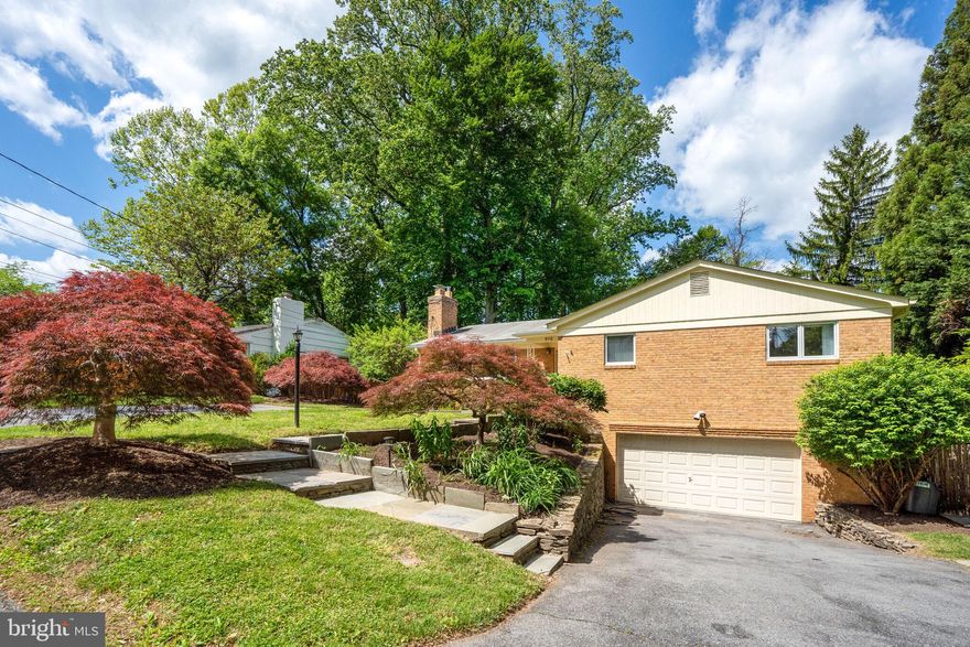 Renovated and spacious  Rambler with  4 BR, 2.5 baths and 2 car garage sited on a terrific & cleared .20 acre lot!! Excellent location in Glen Echo Heights with quick access to public transportation at  Sangamore road, Mass Ave and easy commute to DC!! The front yard is very inviting and beautifully landscaped with Japanese maples.  The main level features an entry foyer, hardwood floors, spacious living room with elegant fireplace and picture window flooding the room with sunlight open to a formal dining room , a recently  renovated kitchen with white tall cabinets, quartz counter tops and S.S  appliances. The kitchen has table space and opens to a deck, perfect for outdoor relaxation or dining, overlooking the gorgeous backyard. The main level has a total of 4 bedrooms and 2 updated bathrooms including a primary bedroom with an ensuite bath and a spacious cedar closet. The lower level features a lovely family room with glass doors that open to the lovely, fully fenced backyard, half bath , a very spacious recreation room with partial day light through small windows, a laundry room and access to the spacious 2 car garage. There is a potential to convert the half bath to a full bath and create a 5th bedroom if needed.  Fabulous location in the Walt Whitman school district and close to shopping, Glen Echo park and the Capital Crescent Trail. Convenient to downtown Bethesda, Friendship Heights and the Metro.