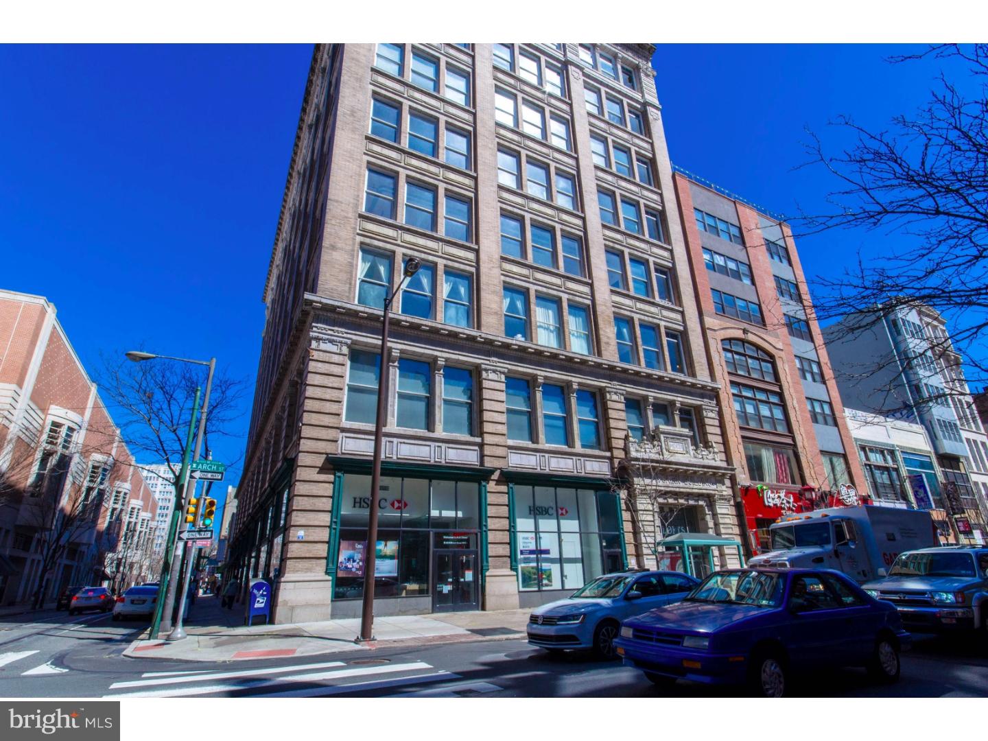Welcome to your true NY style corner loft condo located in the historic Pitcairn Building which is an 8-Story well-managed building in one of Center City's most hip locations. 10 foot high windows wrap the unit and allow for an incredible amount of sun exposure and the unit has 15+ ft soaring wood beamed ceilings. Kitchen comes complete with SS appliances, gray cabinetry. Iron stair case leads to the mezzanine level with a master bedroom. Both bathrooms are tiled with whirlpool tubs. Bonus storage area off master bath. Washer & dryer are located on the main level. Nice closet space. Very cool space and an excellent value. The building is in a prime location. 99 Walkscore and on its way to 100! Not only 1 block to reading Terminal and easily walkable to all that Center City has to offer including an ever-expanding array of trendy shops, restaurants, markets, and more. Entrance From Arch Street into spacious & beautiful Terrazzo lobby to modern passenger elevators. 2 Bedroom/2 Bath bi-level loft is designed for flexible and creative use of the open floor plan. Easy access in and out of the City with Septa Rail and Buses...major highways nearby. Parking lots nearby. Building is FHA approved and warrantable. A really cool loft in an awesome location.