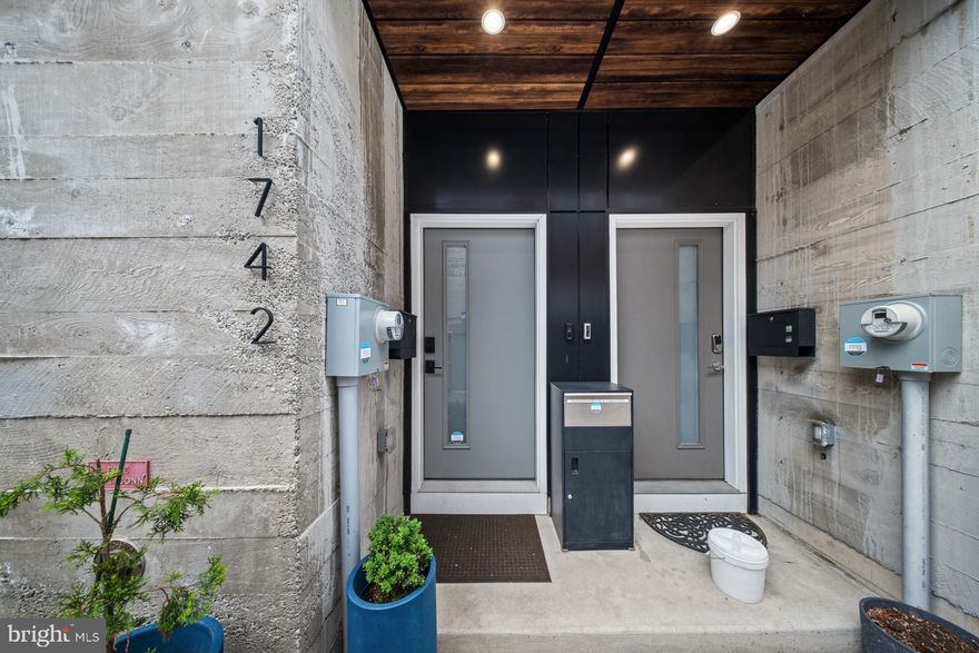 Welcome to 1742 N Hope Street, a standout home with exceptional finishes and amenities in the Regent Row community. This thoughtfully designed newer construction home was completed in 2022, offering a perfect blend of modern living and vibrant neighborhood energy in the heart of Olde Kensington. The home also includes highly coveted garage parking, a rare find in the area. This spacious three bedroom, two and a half bath residence stands out with a highly functional layout, elevated finishes, and four separate outdoor spaces that truly expand your living experience. 

Step inside from Hope Street to find the first level, which offers a convenient coat closet, powder room, access to the garage, and a bonus flex room perfect for a home office. One flight up, you will find the main living and entertaining space. This level features an open concept layout with wide plank hardwood floors, recessed lighting, a ventless fireplace, and an expanded kitchen.The kitchen is equipped with stainless steel LG and Whirlpool appliances, including a range hood, sleek countertops, a herringbone pattern backsplash, under cabinet lighting, and a kitchen island with waterfall counters and seating. The sellers thoughtfully expanded the kitchen to include additional counter and cabinet space, along with a built-in beverage refrigerator. Just off the living room, you will find the first of four outdoor spaces. This extra large deck is perfect for outdoor dining, planters, and summer gatherings.

The third level features two bedrooms with oversized windows, along with a shared hall bath. Both bedrooms offer ceiling fans, hardwood floors, and ample closet space. This level also includes a hall linen closet and a dedicated laundry room for added convenience.

One flight up, you will find the primary suite. The private primary suite offers a peaceful retreat, thoughtfully set apart from the rest of the home. This spacious sanctuary features two outdoor spaces, perfect for enjoying fresh air and quiet moments morning or evening. Inside, a full built-in wardrobe provides generous and stylish storage, while the en suite primary bath is finished with clean, modern and quality fixtures.

One level above, the roof deck offers an expansive outdoor setting with impressive views. A convenient wet bar makes entertaining easy and enjoyable.

What truly sets this home apart is the abundance of outdoor space, offering multiple areas to relax, entertain, or take in the city views. Whether hosting guests or enjoying a quiet morning coffee, these spaces add a rare dimension to city living.

Located just steps from the energy of Frankford Avenue and Front Street, you are within easy walking distance of some of the neighborhood’s most exciting restaurants, cafes, and local favorites. Olde Kensington continues to grow as one of Philadelphia’s most sought after areas. This is a unique opportunity to own a nearly new home with exceptional indoor and outdoor living, plus highly coveted garage parking. The home is in close proximity to popular neighborhood destinations including LMNO, Kalaya, Percy, Ama, Jaffa Bar, The International Bar, Sacred Vice, Mecha Noodle Bar, and Evil Genius. Enjoy easy access to Center City via the Berks Street El stop just one block away. Looking for green space? Palmer Park is also just one block away, and Palmer Doggie Depot is a short stroll from the home, offering a great spot for your pups.