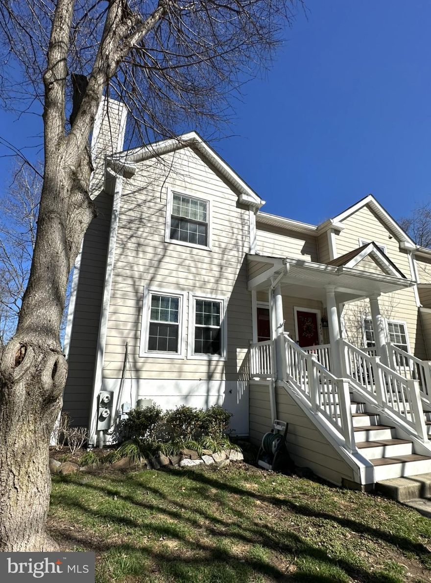 This two-story, end-unit condo is nestled away in the sought-after Dorsey Hall community.  Walk into a bright and inviting living space, featuring a fireplace and breakfast bar. The kitchen is updated with modern white cabinetry, granite countertops, and room for a dining set. The upper level includes a primary suite with a large closet and an en-suite bathroom, along with two additional bedrooms and a second full bathroom. For added convenience, a full-sized washer and dryer are also located on the second floor. Throughout the home, abundant windows provide excellent natural light, and the kitchen’s glass slider leads to a private balcony overlooking a peaceful wooded area. This lovely home is ideally situated near a variety of local shopping, dining, and entertainment options.