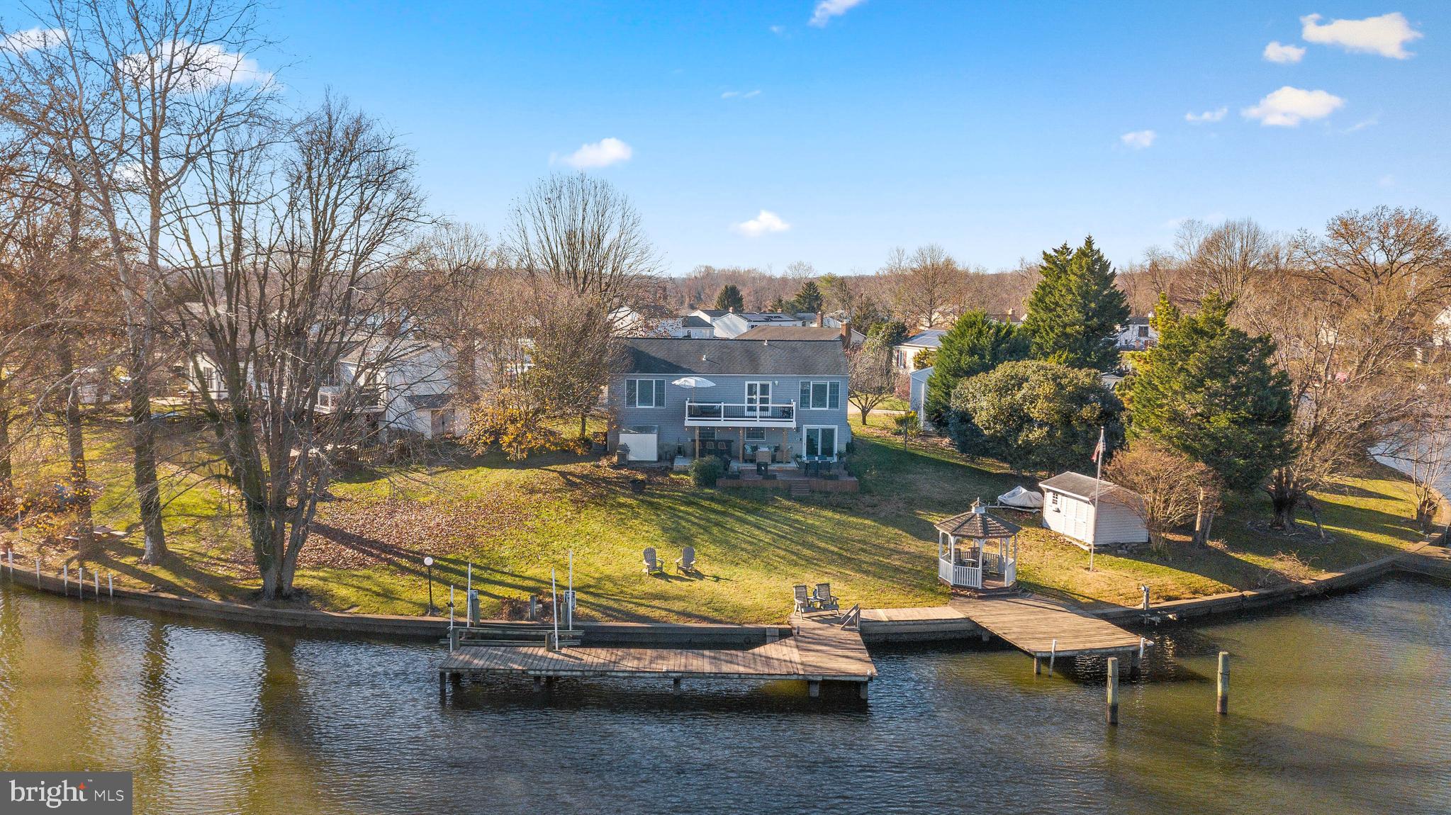 Perfectly situated at the end of a quiet cul de sac is this waterfront 4 bedroom, 2 full and 1 half bathroom house with designer touches throughout. Thoughtfully updated with neutral paint, fresh lighting and updated kitchen and baths, this home has it all- including 125' of water frontage on Taylor Creek. Designer inspired kitchen with white cabinetry, tiled backsplash and stainless appliances. Big views from nearly every room! Rear yard is perfect for entertaining. Storage shed plus 1 car garage. Close to shopping, dining & entertainment. Schedule your private tour today!