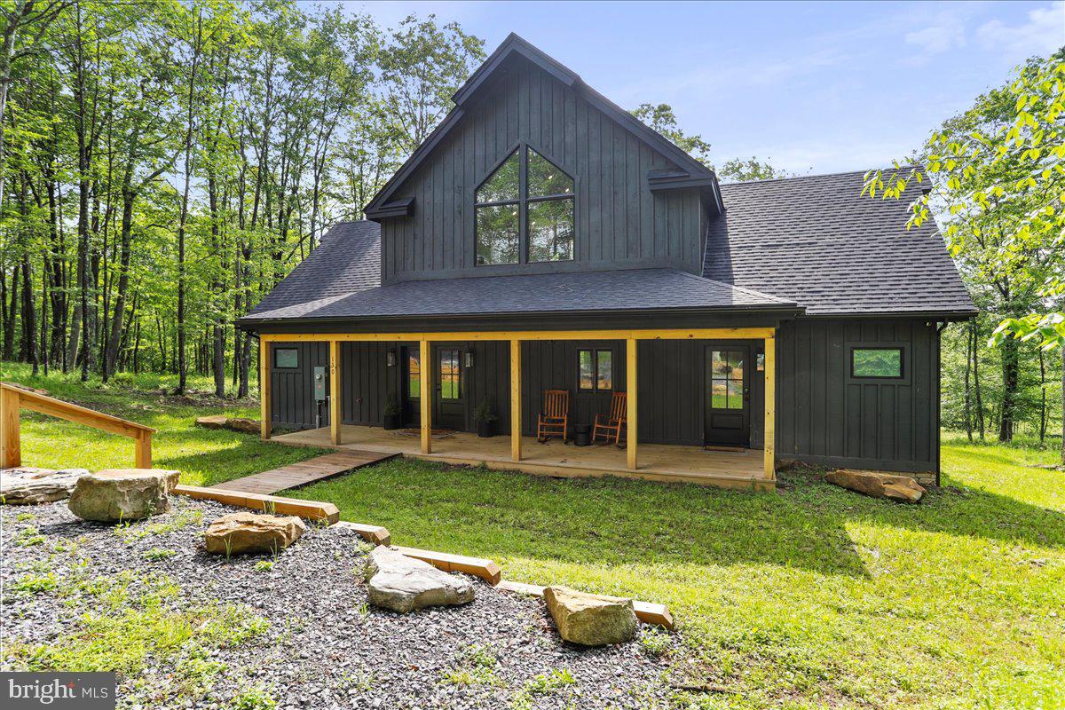 Welcome to "Golden Overlook" — a beautifully furnished, brand-new mountain retreat built in 2024 tucked alongside Lodestone Golf Course and just minutes from Deep Creek Lake and Wisp Ski Resort. With 4 bedrooms, 3 full baths, and over 2,500 square feet of finished space, this home offers the perfect blend of modern comfort and mountain charm.
From the moment you step inside, you’ll be greeted by a sunlit open living area with floor-to-ceiling windows that showcase the peaceful, private setting and golf course views. The stone fireplace, vaulted ceilings, and high-end finishes throughout create an inviting space to relax, entertain, or simply soak in the surroundings.
**The road will be paved once construction is complete**
Step outside to enjoy the expansive covered deck and hot tub, ideal for morning coffee, après-ski unwinding, or a starlit soak. A fire pit sits just beyond for evening s’mores and storytelling. The half-acre lot offers nice views, privacy, and a true escape-from-it-all vibe — yet you’re just a quick drive to Deep Creek Lake’s best year-round activities.
Currently operating as a successful short-term rental with Railey Vacations, this home is known as “Golden Overlook” and comes with a strong rental history, it's fully furnished and has everything you need to hit the ground running with an Average Daily Rental Rate of $309 and a Projected Gross Annual Rental Income of $38k to $55k annually.
Whether you're looking for an income-producing investment or a personal mountain getaway, 130 Lodestone Way offers the best of both worlds — style, setting, and serious short-term rental potential.