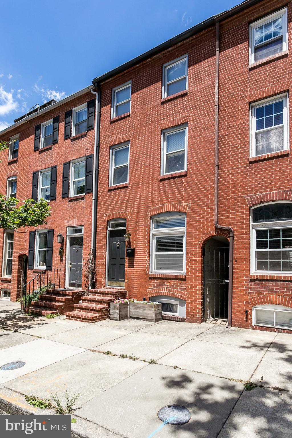 Simply charming Upper Fells Point home will have you swooning. This classic two bedroom two and a half bath Butcher Hill home boasts original hardwood floors, vaulted ceiling, with many thoughtful updates throughout. You'll forget you are in the city when you enjoy your private patio space, and with two private master suites, you'll never share a bathroom again! All of this nestled on quite Bank St. where the best of the city is steps away. Easy walk to the nightlife and shopping of Fells Point, Canton, and Harbor East and easy commuter access to 95,895, and 83. This home is why we love charm city living!