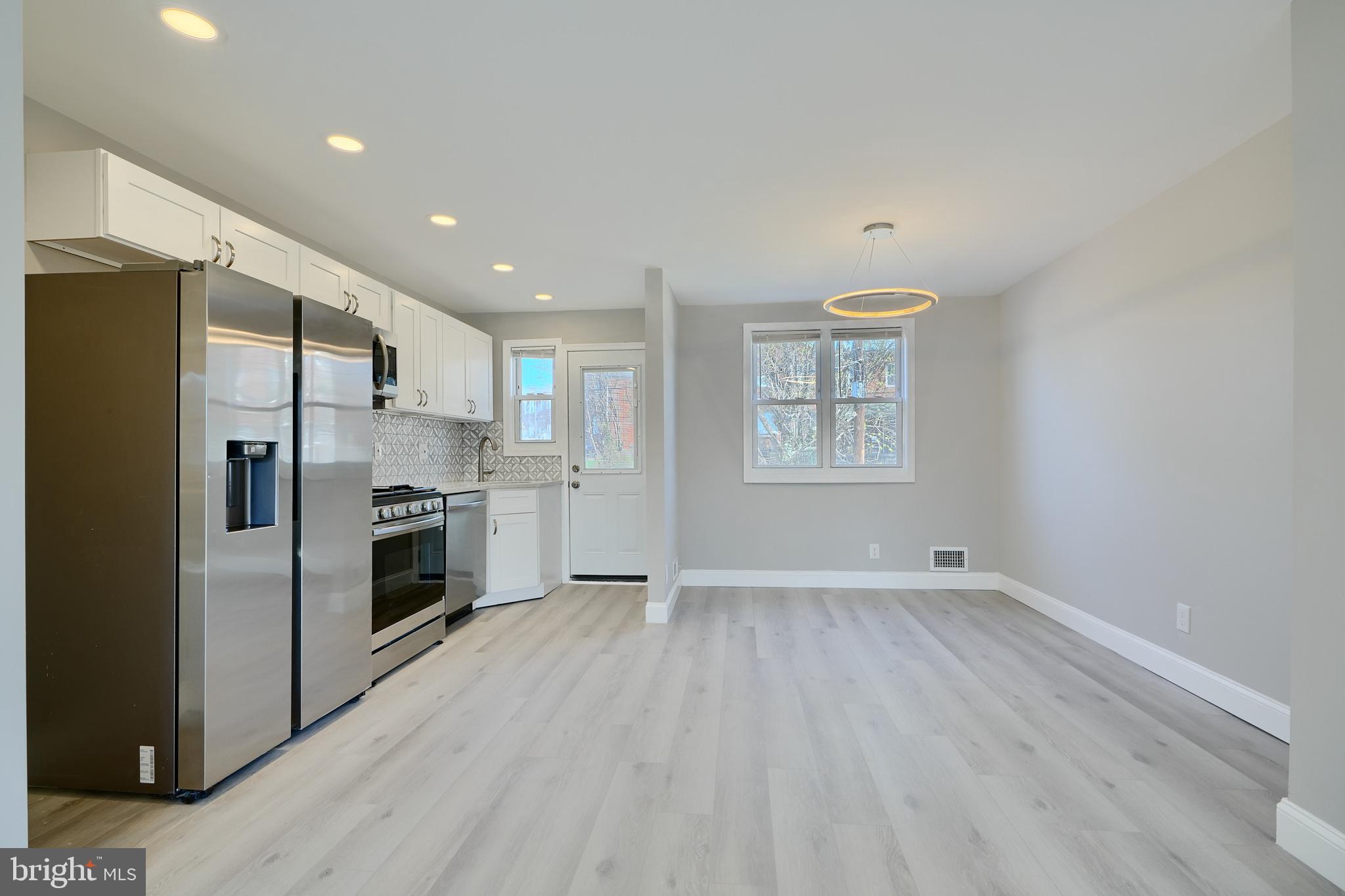 Beautiful Renovation! Open Layout! Well lit Home! Gorgeous Kitchen with Stainless Appliances, Quartz Countertop, Elegant Coordinating Backsplash, and Wood Shaker Cabinets. Upstairs Bathroom features Custom Tilework, Designer Fixtures, and Designer Lighting. Fully Finished Basement Suite includes a Family Room, plus Bedroom and Full Bathroom with Subway Tile and Designer Fixtures. Beautiful Deck, Replacement Windows, New Carpet and LVT Flooring, New Central Heat & AC, Cool Modern Lighting., All New Doors - Interior and Exterior! You will Love this Home!