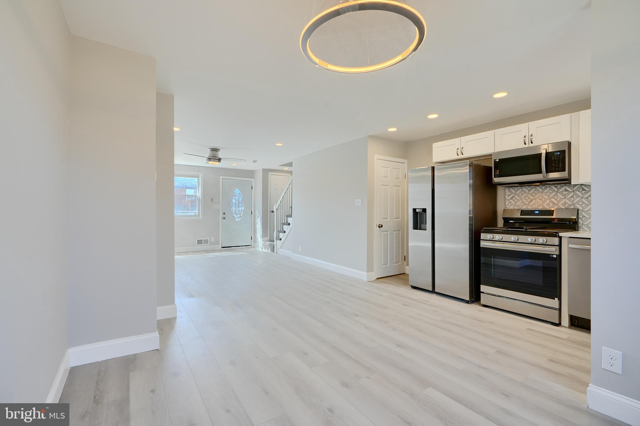 Beautiful Renovation! Open Layout! Well lit Home! Gorgeous Kitchen with Stainless Appliances, Quartz Countertop, Elegant Coordinating Backsplash, and Wood Shaker Cabinets. Upstairs Bathroom features Custom Tilework, Designer Fixtures, and Designer Lighting. Fully Finished Basement Suite includes a Family Room, plus Bedroom and Full Bathroom with Subway Tile and Designer Fixtures. Beautiful Deck, Replacement Windows, New Carpet and LVT Flooring, New Central Heat & AC, Cool Modern Lighting., All New Doors - Interior and Exterior! You will Love this Home!