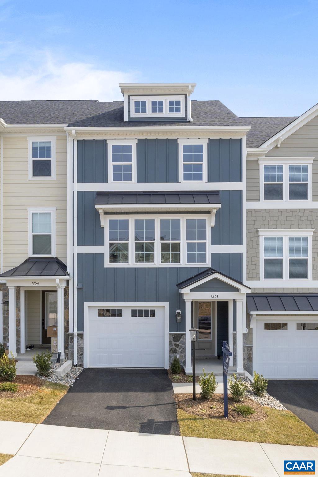 Now selling in the newest phase of The Grove at Brookhill. This proposed Holly townhome offers a well-planned layout in a convenient location just minutes from Route 29. On the main level, you'll find a private bedroom with an attached full bath, ideal for guests, a gym or den. Upstairs, the open living area connects to a galley-style kitchen and leads out to a low-maintenance deck. The home also includes a one-car garage, a top-floor loft, and a rooftop terrace. Planned community features include walking trails, green spaces, tennis courts, and play areas. Estimated completion is December. Pricing reflects base model; design choices can still be personalized. Photos shown are similar and may include upgrades.,Granite Counter,Painted Cabinets