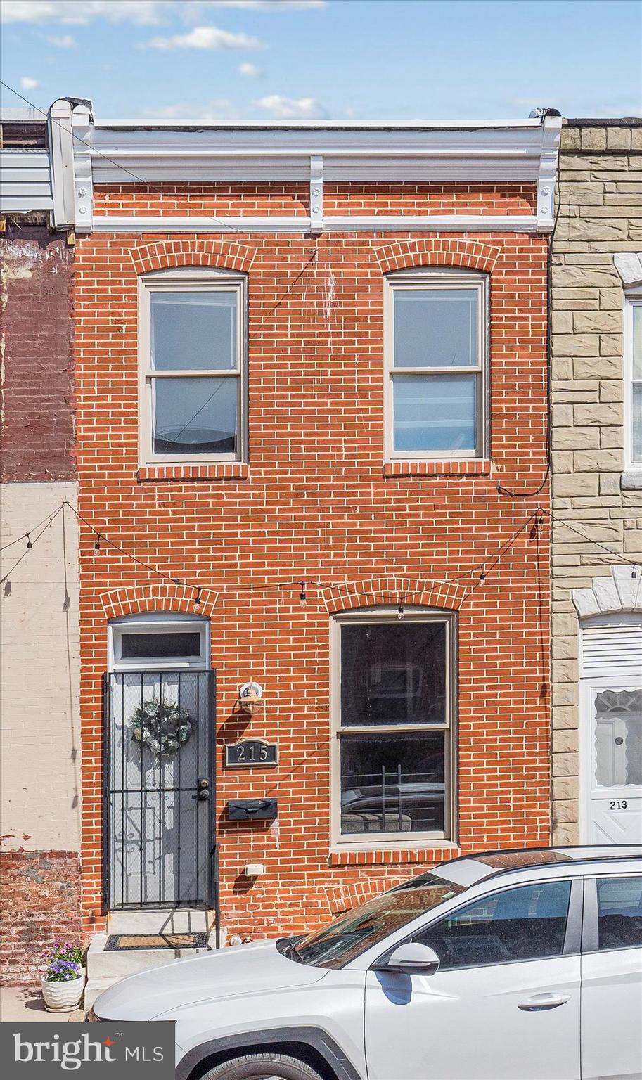 Welcome home to this beautiful and well-maintained 3 bedroom, 2 bath townhome. You will fall in love with the open-floor plan first level that includes a natural light-filled living room and gleaming hardwood floors. The upper level has 2 spacious bedrooms, an updated full bathroom including a soaking bath, and walk-in shower, high ceilings, and Charm City's exposed brick feature. The finished lower level includes a full bath and bedroom, washer dryer, and extra living space with plenty of storage. There is easy access to downtown and major highways! Bonus features include private back patio for outdoor entertaining and newer HVAC unit. *Seller prefers a rent back*