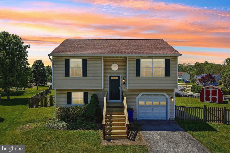 OPEN HOUSE**Sunday 5/17 1-3PM**Charming 3 bedroom, 2 full bathroom home with garage sitting on a spacious.34 acre fenced-in yard in a convenient No HOA community! The main level is defined by a soaring vaulted ceiling in the living room. The heart of the home is the kitchen with beautiful granite countertops, stainless steel appliances and skylights for tons of natural light. Primary bedroom with ensuite. Lower level with 3rd bedroom, laundry room, storage space with rough-in. Outside, you can take-in the gorgeous views from your large back deck with stairs to your huge backyard with large storage shed. Easily walk to local restaurants and the grocery store in minutes. Frederick, Gettysburg, Ski Liberty and Mount St Mary's University located within easy driving distance.
