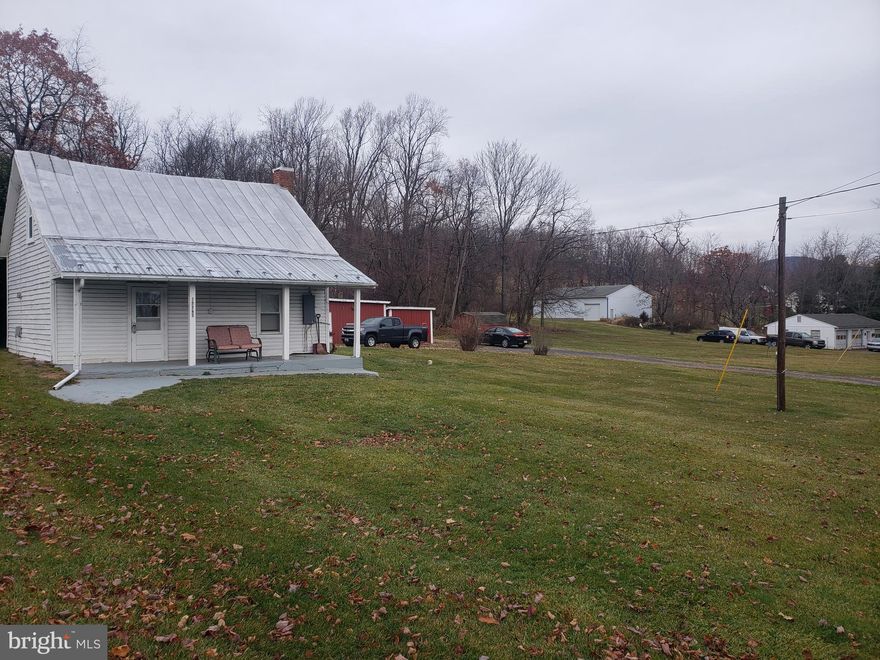 Estate sale - wonderful opportunity to own a gorgeous property and build a magnificent home in Frederick County! Home has 2+ bedrooms, a full bath and a fully equipped kitchen. Ceilings are a little low on the first floor - around 6'. Already has septic and well, 4 outbuildings, and plenty of flat ground to build. 2.2 acres - half cleared, half wooded and private. For the builders out there, save the impact fee with the kitchen wall with the huge brick fireplace- quite the showstopper! Should not be missed - call for any questions. Please do not stop in the driveway or enter any of the buildings without an agent and an appointment. Cameras on premises.