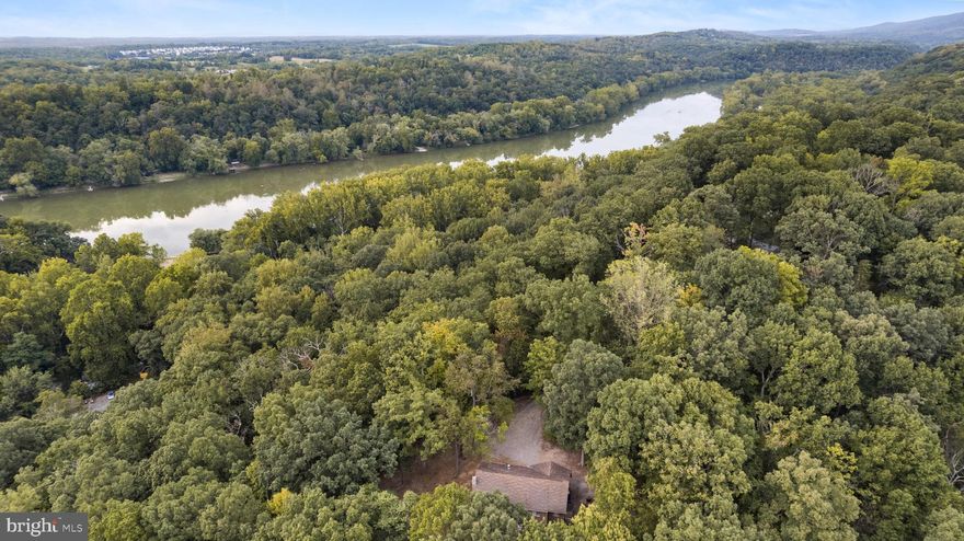 Great starter home or Investment opportunity near the Shenandoah river!
With a little imagination and vision, you can transform this 3 Bedroom, 2 Full Bath home into a spectacular property. Main Level living with brick fireplace and real hardwood floors. Walkout basement offers 2 bonus finished rooms, ample storage, and large rec space with wood stove . Almost 1400 sqft finished with more increase living space!  Located at the end of a quiet road and completely surrounded by nature. Perfect for full-time living or Airbnb!