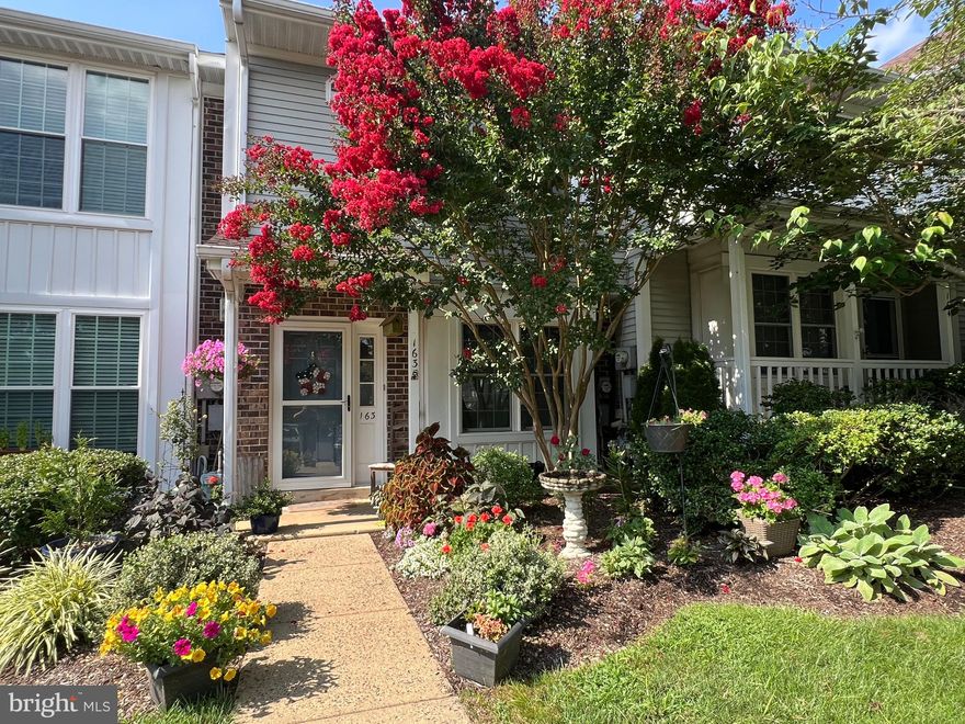 This lovingly cared-for home stands out with its vibrant, flowering yard and a long list of custom features. Inside, you'll find comfortably-chosen colors, a sun-filled kitchen with skylight and French doors leading to a back patio perfect for entertaining. Also in the spacious kitchen, a custom pet nook adds charming space for your furry friends. The second level offers two spacious bedrooms and a full bathroom. The primary bedroom features a sleek, built-in wall bed perfect for guests or maximizing living space. Off this bedroom is secondary access to the full bathroom, with shower and tub. From the upper landing, there is easy access to a 550 square foot attic, refloored to provide storage space and usability. Quietly tucked away with ample parking and walking distance from the beautiful Tyler State Park, this home blends comfort, care, and creativity in every detail. Its proximity to local shopping and location directly across the way from the community pool make it the perfect spot to settle in Newtown.
