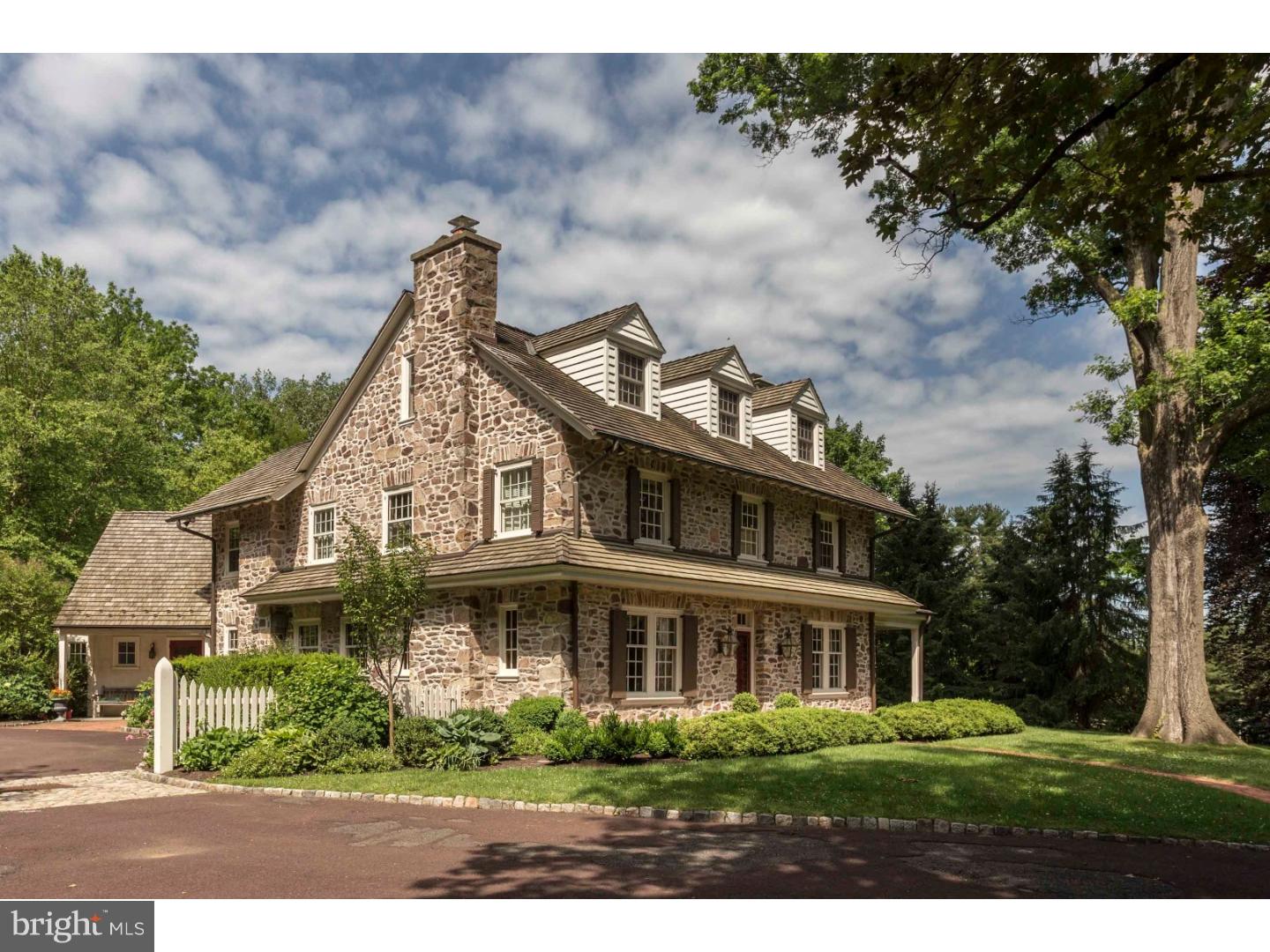 Beautifully restored 1800's fieldstone colonial situated on a private 2+ acre property, bordering Sunnybrook Golf Club in Whitemarsh Township. The house is approached by a long driveway, ending in a courtyard with a 3 car detached garage with second floor loft and barn door access. The front entryway opens to a center hall, flanked by a large living room with double French doors providing access to a covered brick porch, and a dining room with custom moldings and cabinetry. Included in the first floor is a spacious, gourmet kitchen with Professional GE Monogram and Subzero appliances, adjoined by a sunny breakfast room overlooking scenic grounds, wet bar, powder room, mudroom, plant/garden room, large family room with a walk in fireplace and French doors leading to a beautiful flagstone terrace. On the second floor, in addition to the master bedroom and a master bath with shower, bathtub and double vanity, there are two bedrooms and a hall bathroom, laundry room, open sitting room, and a lovely office/family room with fireplace. The third floor provides two more bedrooms and a hall bath with soaking tub and shower stall. Outstanding features of this house are detailed millwork and moldings, random width flooring throughout, five fireplaces, abundant closets and thoughtfully designed built in storage spaces, finished basement, new cedar shake roof, updated mechanical, electrical systems including a back up generator. Mature, meticulously maintained landscaping and perennial and herb gardens complete the picture. This is a rare opportunity to own a magnificent property in a premium country location, just minutes to Chestnut Hill, Erdenheim Farm, and an easy commute to the Main Line and Center City.