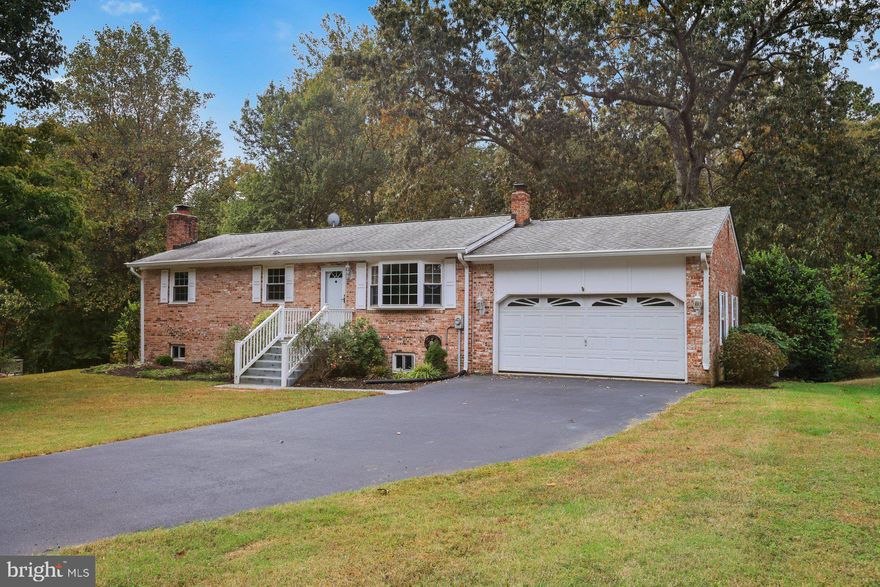 Come home to this beautiful 4 bedroom/2.5 bath raised  rambler in Hollywood!  Brick home with oversized one car garage on large, fenced lot that backs to woods and almost fully updated!! Gorgeous laminate wood flooring throughout main level, new paint, fully renovated kitchen with stainless appliances, masonry gas fireplace in large family room, quiet culdesac off a dead end street, NO HOA and so much more!! What's not to love? Book your showing today!