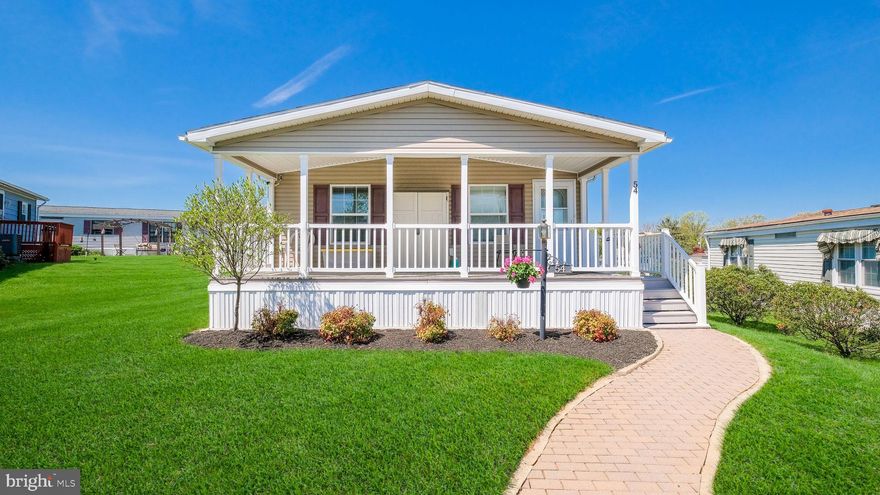 Wow! Curb appeal plus and so much more! Beautiful 2 Bed, 2 Bath rancher with over 1,240 sqft.  Built in  2010 the home features an open layout, bedrooms on each end of the home for privacy. Enjoy your morning coffee as you watch the sunrise on your covered front Trex deck! Excellent location within a few steps from the new Clubhouse that features a fitness room, library, game room and huge community room. Walk out onto the veranda that overlooks the heated pool! Weekly shuttle to markets along with many activities and trips. Make your appointment today! Professional pictures coming soon