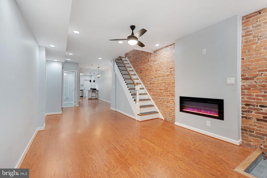 PRICE IMPROVEMENT!!! Motivated seller - BRING YOUR OFFER!!! Welcome to 2434 McCulloh St, a beautifully renovated 3-bedroom, 2.5-bath home combining modern luxury with timeless charm. From the moment you step in, you’ll notice the attention to detail, with stunning hardwood floors and LED recessed lighting throughout. The open-concept living area features exposed brick and an electric fireplace, creating a warm and inviting space.

The kitchen is a chef’s dream, boasting a waterfall peninsula with quartz countertops, stainless steel appliances, and sleek cabinetry. Upstairs, the primary bedroom is a true retreat with an ensuite bath featuring a luxurious walk-in shower. The built-in closet shelves provide ample storage, and the barn doors on both second-floor bathrooms add a unique touch of style.

The finished basement offers additional living space, perfect for a home office, gym, or entertainment area. Efficiency is at the forefront, with a tankless water heater ensuring you’ll never run out of hot water, and a smart thermostat that allows you to control the home’s temperature from anywhere with your smartphone.

Additional modern features include WiFi-enabled and motion sensor lights for added convenience. Outside, enjoy the large deck, perfect for outdoor entertaining, and a fully fenced backyard with a parking pad for off-street parking.

Best of all, this property is eligible for the $10,000 Vacants to Value Grant for owner-occupants, providing incredible savings for your new home.

This home has it all—style, comfort, and practicality—right in the heart of Baltimore. Don’t wait, schedule your tour today!