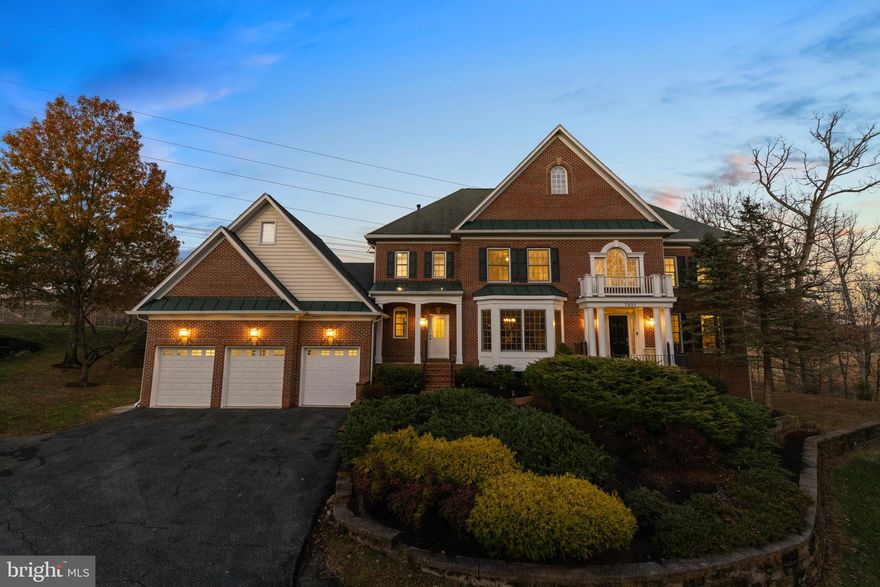 Welcome to this elegant Potomac residence, gracefully perched on a hill within a private three-home enclave at the edge of Inverness Forest. This distinguished home offers a three-car garage and showcases exquisite architectural detailing throughout, including crown molding, curved archways, and tray ceilings. Step into the grand foyer, where a sweeping staircase introduces the adjacent formal living and dining rooms. A private study is thoughtfully positioned just off the spacious gathering room. An arched pass-through leads to the expansive gourmet kitchen, featuring abundant cabinetry and countertop space, a center cooktop island, a walk-in pantry, and a sun-filled breakfast area. With its exceptional layout, generous storage, and multiple work zones (including dual sinks, dishwashers, and a double oven), the kitchen is well-equipped for everyday living and entertaining. Additional main-level conveniences include a walk-in pantry, a dedicated laundry room, and two separate powder rooms. The upper level hosts a luxurious primary suite complete with a tray ceiling, a step-down sitting room, a dressing room, two walk-in closets, and a spa-inspired bath with a soaking tub. Three additional bedrooms, including a generously sized suite with its own private bath, provide comfort and flexibility for family or guests. The walk-out lower level extends the home's living space with an additional bedroom and full bath, a spacious recreation room with a fireplace, two finished flex rooms ideal for a gym or media room, and an expansive storage area within the mechanical room. An oversized three-car garage completes this exceptional offering, providing ample space for vehicles and additional storage. Enjoy the tranquility of peaceful, tree-lined streets paired with outstanding convenience. This prime Potomac location places you close to Potomac shopping and dining, premier country clubs, top-rated schools, and scenic destinations such as Great Falls and the C&O Canal, and offers effortless access to I-495, I-270, and downtown Washington, DC.
