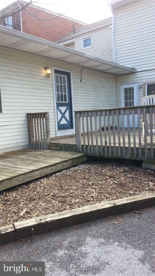 Lovely 1 bedroom 1 bath 1st Fl. apartment with a private entrance, off street parking, and lovely deck. It also features electric stove, refrigerator, ceiling fan, and baseboard electric heat. Monthly rent is $700 which includes water & sewer. Tenant pays electric, trash & cable. NO SMOKING - NO CATS. Small non-violent dog permitted with $50 per month pet fee. Shared, coin-operated laundry facilities are located in the lobby in the front of building. Convenient to major highways, shops & restaurants.