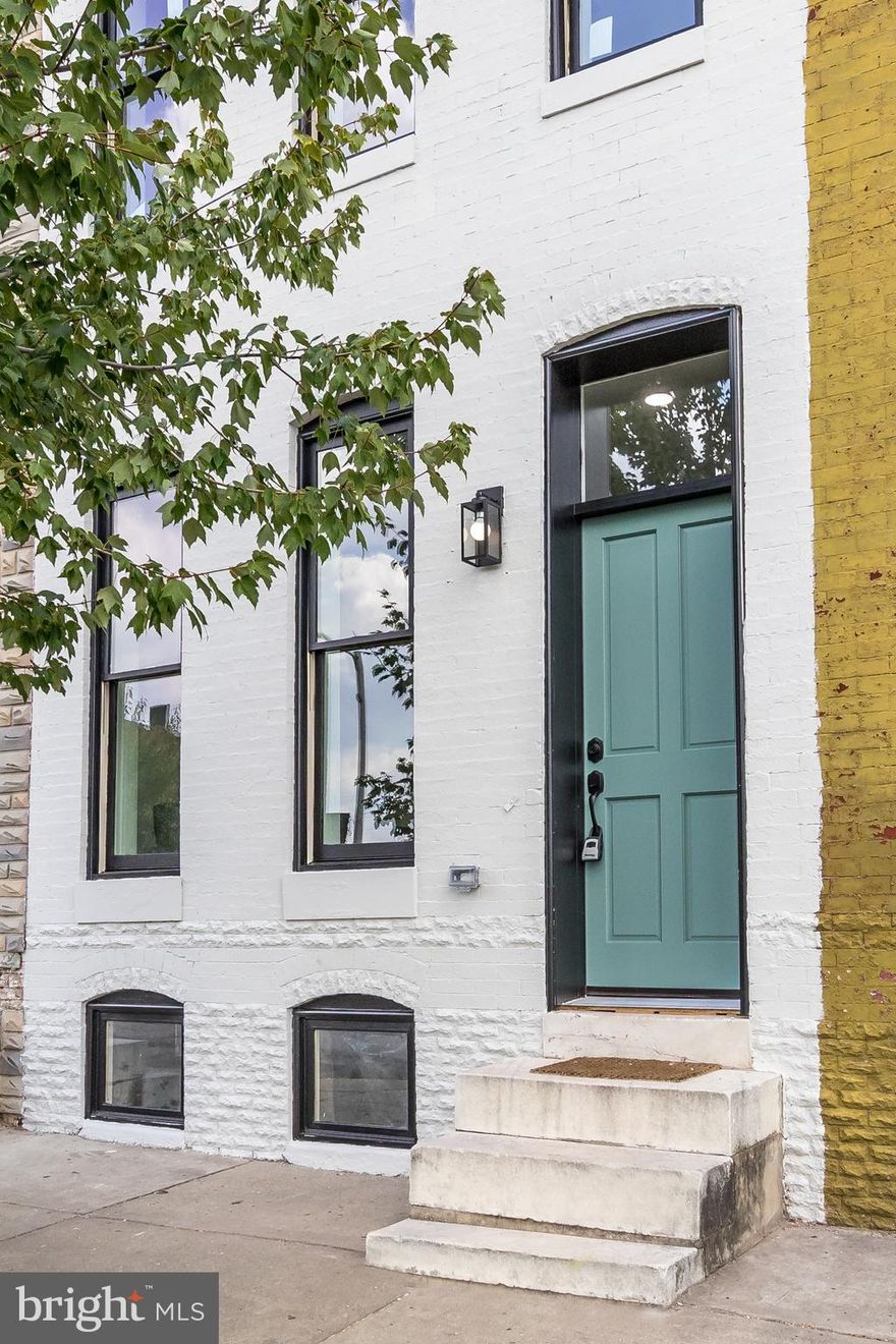 WELCOME TO BALTIMORE AT ITS MOST CHARMING.  THIS STUNNING REHAB WILL IMPRESS AND DELIGHT FROM START TO FINISH.  ENTER INTO A COMPLETELY MODERN OPEN-CONCEPT FLOOR PLAN.  SO MUCH LIGHTING AND NEXT LEVEL LIGHT FIXTURES ADORN.  A HALF BATH PROVIDES ULTIMATE CONVENIENCE. THE CHARMING MOUNTED FIREPLACE SETS THE MOOD AS YOU HEAD INTO THE KITCHEN. BE WOWED BY TOP-NOTCH STAINLESS APPLIANCES, GRANITE COUNTERTOPS AND CABINETS TO MARVEL AT. EVERYTHING SCREAMS STYLE! HEAD UPSTAIRS AND BE GREETED BY A COZY SITTING AREA. HEAD LEFT OR RIGHT AND APPRECIATE TWO SEPARATE EN SUITES FOR TOTAL PRIVACY AND PEACE. A FENCED IN BACKYARD FOR COOKOUTS IS A MUST. THIS UNIT FEAUTURES NEW HVAC, NEW ROOF, NEW ELECTRIC, NEW WINDOWS THAT PROVIDE A 10-YEAR CHAP TAX CREDIT. INFO PROVIDED. THIS UNIT IS ALSO UNIQUELY QUALIFIED FOR A GRANT FROM BALTIMORE CITY UP TO $10,000. ASK FOR DETAILS. BE THE FIRST IN THIS STUNNING BLOCK AT A WELCOME PRICE THAT WON'T BE REPEATED. REHAB ON UNITS ON BOTH SIDES HAS BEGUN AND WILL BE DONE SHORTLY.