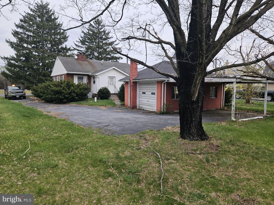 This cozy brick ranch offers timeless charm with hardwood floors, a vintage tiled bath, and bright, sun-filled rooms. Set on a lovely lot with mature trees and shrubs. A perfect canvas for your personal touch or investment vision.