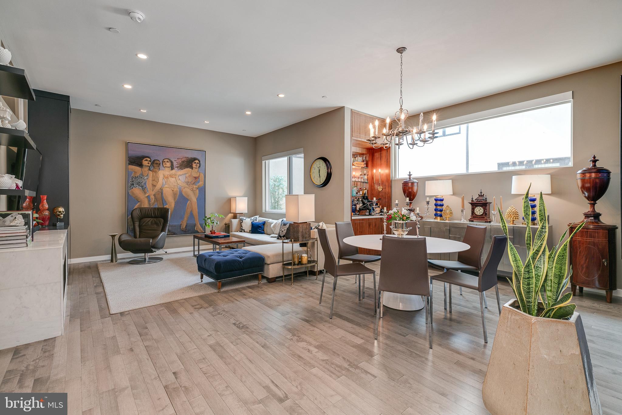 Welcome to 818 N 4th Street: Make your home in this spacious unit with over 1,645 sq ft of living space and a 559 sq ft private deck with storage. Unit 2E is located within a quiet boutique condominium in the heart of Northern Liberties. The condo comes with a 1-car deeded parking in the building's attached temperature controlled garage. Low condo fees and approximately 6 years remaining on the tax abatement. The main living area is warm and spacious, with an open plan that is perfect for entertaining. The living room has large windows, built-in shelving, and gas fireplace. The dining area features an accent wall and built-in bar area. Chefs will find their dream kitchen with its sleek custom cabinetry, top of the line Wolf appliances, SubZero refrigerator including a wine storage, and enormous single slab center island. Just off the kitchen walk onto your large 43' x 13' balcony w/ storage unit. For convenience, there is a lovely powder room just inside the home off the foyer. As we enter back into the home, we'll head past the kitchen to the first of two guest bedrooms. The first bedroom has an oversized window for abundant natural light and a large closet. The spacious hallway opens to a guest full bathroom with shower and the second of the guest bedrooms (currently used as an office). The expansive owner's suite boasts two custom closets and a large ensuite owner's 5-piece bathroom. An oversized shower, freestanding soaking tub, water closet and his and her vanities complete this incredible space. Located on a tree-lined block in Northern Liberties and ideally situated between Old City and Fishtown, this unrivaled home is surrounded by outstanding boutiques, restaurants and nightlife venues with The Piazza/Schmidt's Common within easy reach. Enjoy great community parks and gardens, including Liberty Lands and East Poplar Playground, and fantastic transportation options with the Spring Garden SEPTA station, ample bus service and the Delaware Expressway all nearby.