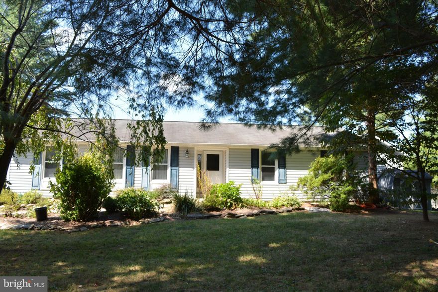 Perfection! Impeccably Sited on Over 6+ Acres of Wooded Privacy and Grand Koi FIlled Pond. The Lush Greenery and Extensive Landscape Abound. 4 Spacious Work Sheds for all Types of Craft and Hobby Offer Endless Opportunities. Horses Welcome.This 4 Bedroom 2.5 Bath Ranch Style Home Offers Roughly 3500+ Square Feet of Comfortable & Updated Space on the Main and Lower Level. A Welcoming Foyer Ushers you in With Elegant Hardwood Flooring, and Stylish Updated Details are Found Throughout the Home.The Main Level Offers a Lovely Blend of Large, Formally Defined Rooms and Wide Openness at the Rear of the Home, Revealing an Expansive, Well Appointed Kitchen with Stainless Steel Appliances, Wood Burning Stove and Breakfast Area for Practical living. Beautiful Architectural Details Including Moldings, Trim, and Built Ins as Well as One Warm and Inviting Wood Burning Fireplace, which Adorns the Family Room. The Dining Room and Formal Living Rooms are Ideal for Entertaining. Almost Every Room Beckons you Outdoors with Idyllic Views onto the Huge Enclosed Porch and Deck. The Main Level also Boasts 3 Generous Bedrooms Including a Spacious Owner's Suite. This Suite Offers a Generous Bedroom, Walk In Closets and a Stylishly Updated Spa-Like Bath. Two Other Bedrooms Share a Second Full Bath . The Lower Level is Expansive and Offers Endless Space for a Recreational Room, and Space for Play or TV Vewing. A Perfect Combination for All Sorts of Entertaining. A Fourth Bedroom, Laundry Room, Cedar Closet and Lots of Storage Await the Discriminating Buyer. All located a the small hamlet of Lovettsville.