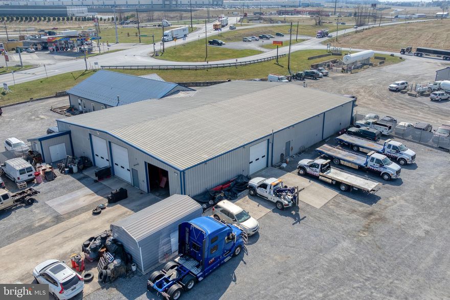 Presenting a rare commercial investment opportunity at 1120 Mt Rock Rd in Shippensburg, PA. This property is comprised of four separate parcels—4.47, 4.0089, 4.0089, and 3.942 acres—that can be purchased individually or together to suit your investment strategy. The flagship 4.47-acre parcel, listed at $1,899,900, boasts a 13,200 sqft building featuring a 3,600 sqft office and a 9,600 sqft industrial garage. With impressive ceiling heights of 16 ft and four drive-in doors, this facility is perfectly suited for industrial, warehousing, or distribution purposes. This property also includes a diesel fueling station that is leased currently by CV Fueling. Adding to its appeal, this parcel currently generates $116,400 in gross annual rents from tenants including CDC Towing, CV Fueling, and Leffler, all on month-to-month
leases. This arrangement provides new owners with flexible options—either occupy the
space for your own operations or retain the current tenants under newly negotiated
lease terms. Don't miss the opportunity to acquire a property that not only offers significant income
potential but also provides the flexibility to expand or tailor your portfolio with
additional parcels awaiting offers.