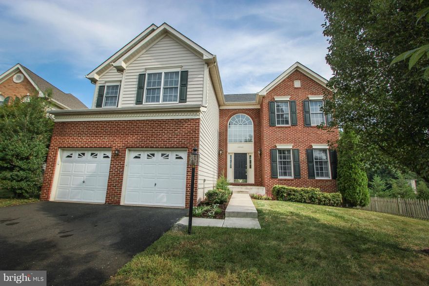 Gorgeous open floor plan with HW floors, 2 story family room w/ stone FP, gourmet kitchen w/ granite, office & main level laundry.  Screened in porch w/ deck and brick patio, fenced in yard that backs to trees.  Finished bsmt w/ full bath, rec room & media room.  Upstairs 4 bedrooms 2 full baths & loft area.