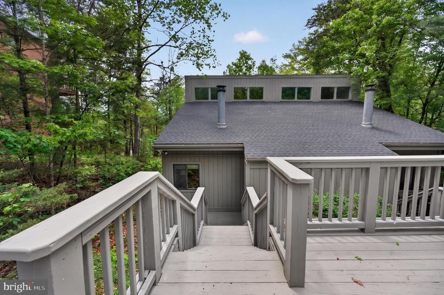 Discover the perfect blend of comfort and modern living in the beautifully updated 2 Bedroom, 2 Bath duplex, ideally situated just outside of Bryce Resort where there are an abundance of outdoor activities nearby including golf, skiing, mountain biking and hiking in the National Forest.  Located just minutes from the stunning 45 acre Lake Laura, you can enjoy swimming, fishing, kayaking as well as relaxing on the grassy beach.
This  inviting unit is move-in ready, showcasing Cathedral ceilings, brand new wood floors in the Great Room, fresh interior paint and updated bathrooms.  When you step inside you are greeted  by a spacious, open layout featuring a Swedish Fireplace that adds to the inviting mountain charm of this home.  Enjoy seamless indoor-outdoor living with direct access  from the first floor bedroom to the lower patio, perfect for morning coffee or evening relaxation.  The private backyard, bordered by a privacy fence , offers a serene space to unwind.  
The upper level offers a large open loft-style bedroom with its own balcony that overlooks the tree canopy.  This bedroom also boasts a full bath featuring a jetted tub and a sauna!
Recent upgrades ensure your peace of mind, including a partial roof replacement on the backside, new windows and sliding glass doors and extensive exterior repairs that includes a new French Drain system. Also included are new floor joists, vapor barrier and insulation.
Conveniently, this charming home is an easy walk down the hill to the local community store, Pale Fire Brewery, Burn Barrel restaurant and Smiley's-where you can indulge in a sweet treat or let the kid in you enjoy putt-putt or gem mining.