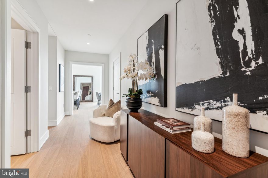Arthaus, a commanding new residential high-rise in Philadelphia’s performing arts district, presents Unit 2502:  A stunning 2-bed, 2.5 bath, 1,817 SF single-level residence with midtown views priced at $1,655,00.  

This maintenance-free, move-in ready, home offers high-end interior design, resort amenities and white gloves services.  Tax abatement is available.  Whether you’re a busy professional, retiree or globe trotter, 2502 is a MUST SEE!

Arthaus impresses from the moment you enter.  The tall solid wood door with elegant hardware sets the stage, leading to a spacious, light-filled foyer with the large coat closet and convenient hallway bath and laundry room facilities.  The great room offers views of the city featuring a blended kitchen, living and dining space with soaring ceilings, floor to ceiling windows, wide-plank Havwood flooring and a weather-protected walk out balcony. Drenched in natural light this space is bright, airy, and feels twice its size on paper.

The chef’s kitchen is everything you need for hosting, with a large center island that seats four.  The two tone kitchen cabinetry by Poggenpohl are polar white and the countertops Golden Gate quartz with matching backsplash. The high-end, stainless appliance package includes: Wolf, Bosch, Sub-Zero and Asko appliances and door fronts have been fully integrated into the cabinet design for a seamless look.

The primary suite and guest bedroom are on the East side of the condominium.   
The guest bedroom is a quiet retreat for visiting guests with gorgeous midtown views and walk-in closet. The full bath in the hallway is finished with porcelain Calacatta tile floors, super white quartz countertops, and polar white matte Poggenpohl cabinets. The spacious Owner’s suite is wrapped in 10' floor-to-ceiling windows and features two step-in closets. A Badeloft soak-in tub, double vanity with Robern mirrors and super white quartz marble, Contempo white marble floors and shower tile, and a Kohler toilet closet complete the best-in-class bathroom package. 

Arthaus is a modern masterpiece crafted by renowned developer Carl Dranoff, designed by Kohn Pedersen Fox and built by Intech Construction.  Its architecture and amenities prioritize wellness and well-being, from the stunning Monet-inspired mosaic in the lobby to the private resort on the 6th and 7th floors, featuring a pool, fitness facilities, spa, salon, pet park, outdoor terraces, lawns, gardens and more.  White glove services include 24-doorman, concierge, chauffeured town car and car valet. 

This home comes with 1 parking license. With the tax abatement annual real estate taxes are approximately $3,443.