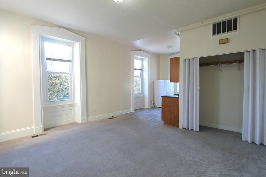 Renovated studio apartment located in the heart of Germantown. Vaulted ceilings, and huge windows provide ample natural lighting and give the apartment a spacious feel. This converted school building is a must see! Full kitchen and enormous open concept living room.  A very unique apartment in the heart of historic Germantown. Just one block off Germantown Avenue and the Germantown train station for easy access to Center City Philadelphia. Only a block away from the recently revitalized Vernon Park. Cat friendly with non refundable upfront fee and monthly pet fee, limit of 2. Off-street parking is available to rent for an additional $25/mo. Shared laundry facilities in basement.