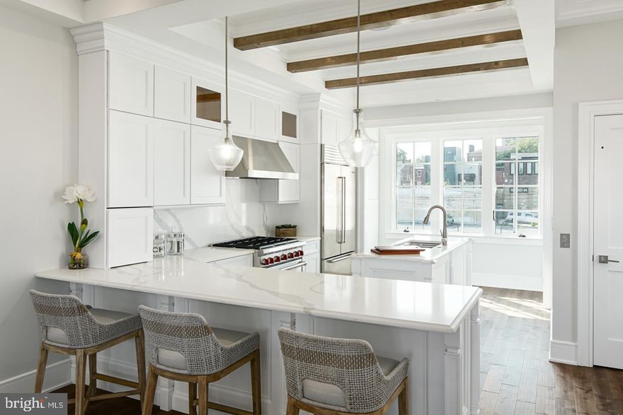 2- CAR PARKING OFFERED! Luxury Living at Lydian Place offers the quintessential city lifestyle. These ten exquisitely designed townhomes on the Avenue of the Arts create a unique urban experience to enjoy the rich cultural life of Center City Philadelphia. Renowned architectural firm Asher Slaunwhite created an eclectic mix of contemporary and classic themes throughout each home. With 4,000 square-foot of living space across 5 levels, each home features 3 spacious bedrooms, four full baths, and two powder rooms, with a masterfully designed pilothouse, two decks, and elevator access! Step up from the light-filled foyer and atrium to the expansive open concept main level framed by a bank of french door-style windows. Enjoy the comfortable living room with high ceilings, custom hardwood flooring throughout, balcony overlooking Broad street, and an ample dining area that flows into the gourmet chef kitchen. Luxurious yet functional, the kitchen features an oversized island, peninsula seating, custom quartz countertops, and backsplash, with appliances from Subzero, Asko, and Wolf. The third floor is comprised of two large bedrooms with en-suite bathrooms, walk-in closets, and a full-sized laundry room. The impressive owner's bedroom suite's regal 600 sq ft is the ultimate sanctuary and occupies the entirety of the fourth floor. The owner bath is wrapped in Calacatta marble style and features a freestanding soaking tub, an oversized shower room of seamless glass, a private lavatory, a double vanity, separate makeup vanity, and fixtures from the striking Kohler Margaux series. Special attention has been given to the rooftop with a masterfully designed layout highlighting a spacious 375 sq ft pilothouse complete with a custom wet bar and convenient powder room nestled between the two separate decks. This optimal space for entertaining offers spectacular panoramic views of the Philadelphia skyline. More home enjoyment comes with the fully finished lower-level family room or media room and includes a bedroom/office/exercise room and full bathroom. There's more: each home offers 1-car garage parking with tons of extra room for storage, a top-of-the-line security system with one year of free monitoring services, and a multi-zoned energy-efficient HVAC system. The audio system includes five pairs of in-ceiling speakers, one pair of outdoor speakers. A Sonos Connect system plays music throughout the entire home. Smart wiring infrastructure is installed for ultimate convenience and future upgrade possibilities with dual data (Cat6) and cable in every bedroom. Upgrade options include an outdoor kitchen and grill, decorative ceilings in the living/kitchen/dining area, a built-in fireplace in the living room, custom millwork, and additional smart-home technology. Walk Score - 97 Transit Score - 100 Bike Score - 88. Conveniently located near Target, Sprouts Market, Whole Foods, Pet Smart, & PA Wine & Spirit Shop. Some homes are currently being built. Taxes estimated, 10 YEAR TAX ABATEMENT, some finish choices may vary, and features are shown may be upgraded. Specifications, details, and finishes are subject to change.