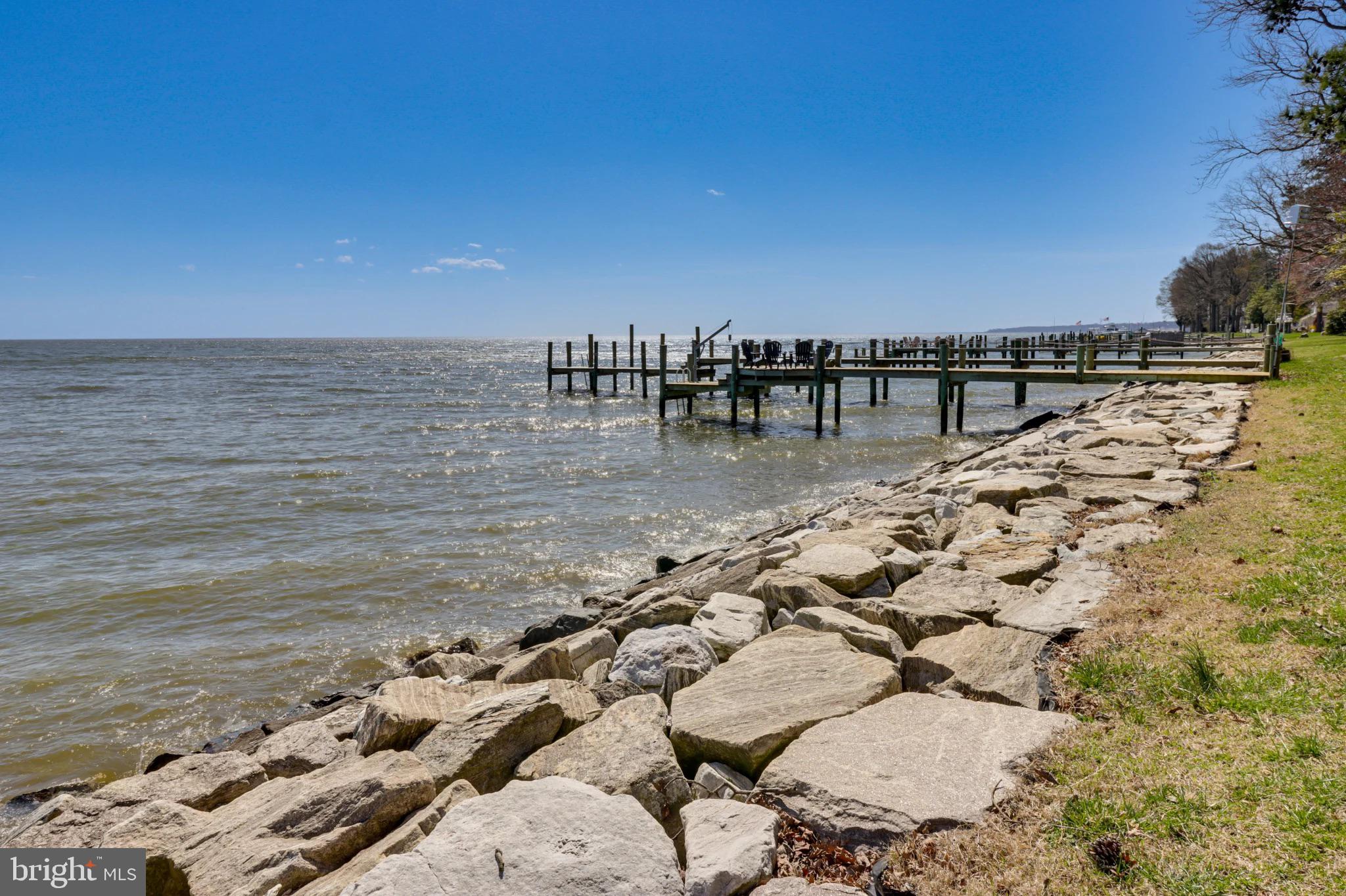 Fabulous opportunity to own an unobstructed WATERFRONT with MILLION DOLLAR VIEWS of the Chesapeake Bay! This gorgeous 3 bedroom, 2 full bath cottage has been completed renovated with all the modern finishes! This original 1920's cottage has been beautifully restored and almost everything new from top to bottom, including top-of-the-line Hardie plank siding, new roof, new HVAC, well tank, water softener, all new flooring, appliances, windows (except for the casement windows), new doors, stackable washer & dryer, ceramic tiled showers in both bathrooms, all new bathroom vanities, kitchen cabinets, quartz countertop, light fixtures, etc!!! Sold mostly furnished so it's perfect as a 2nd home or rent it out as an Airbnb! Seller has already obtained approval from the county to build a private pier and boat lift. Easy drive to Washington DC! Close to Herrington Harbor Yacht club, shopping, restaurants, boardwalk, beach and water access!