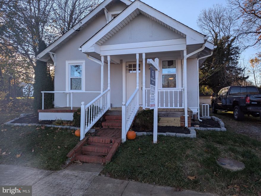 HUGE Price adjustment!  Sellers are motivated! Construction is finally finished and permits acquired!  The house is ready to go! This cozy bungalow is located in the heart of Charles Town. It has been recently renovated from top to bottom, including a new roof in June 2023. The exterior has been freshly painted, and all new high-end appliances have been installed, including new cabinets, a quartz countertop, and COREtec Alba Marble LVT in the kitchen and bath. The original walnut hardwood floors have been refinished and look amazing. New American Craftsman windows are energy efficient, and all new doors, base trim, and appliances have been installed throughout the house. All plumbing and electricity have been updated, and off-street parking is available. The huge backyard is perfect for entertaining and enjoying a fire pit. The home is an easy walk to historic Charles Town for dinner.  There is plenty of room in the attic for a third bedroom and bath and plenty of room to add on if desired. Inspections are for information only. Agent related to seller