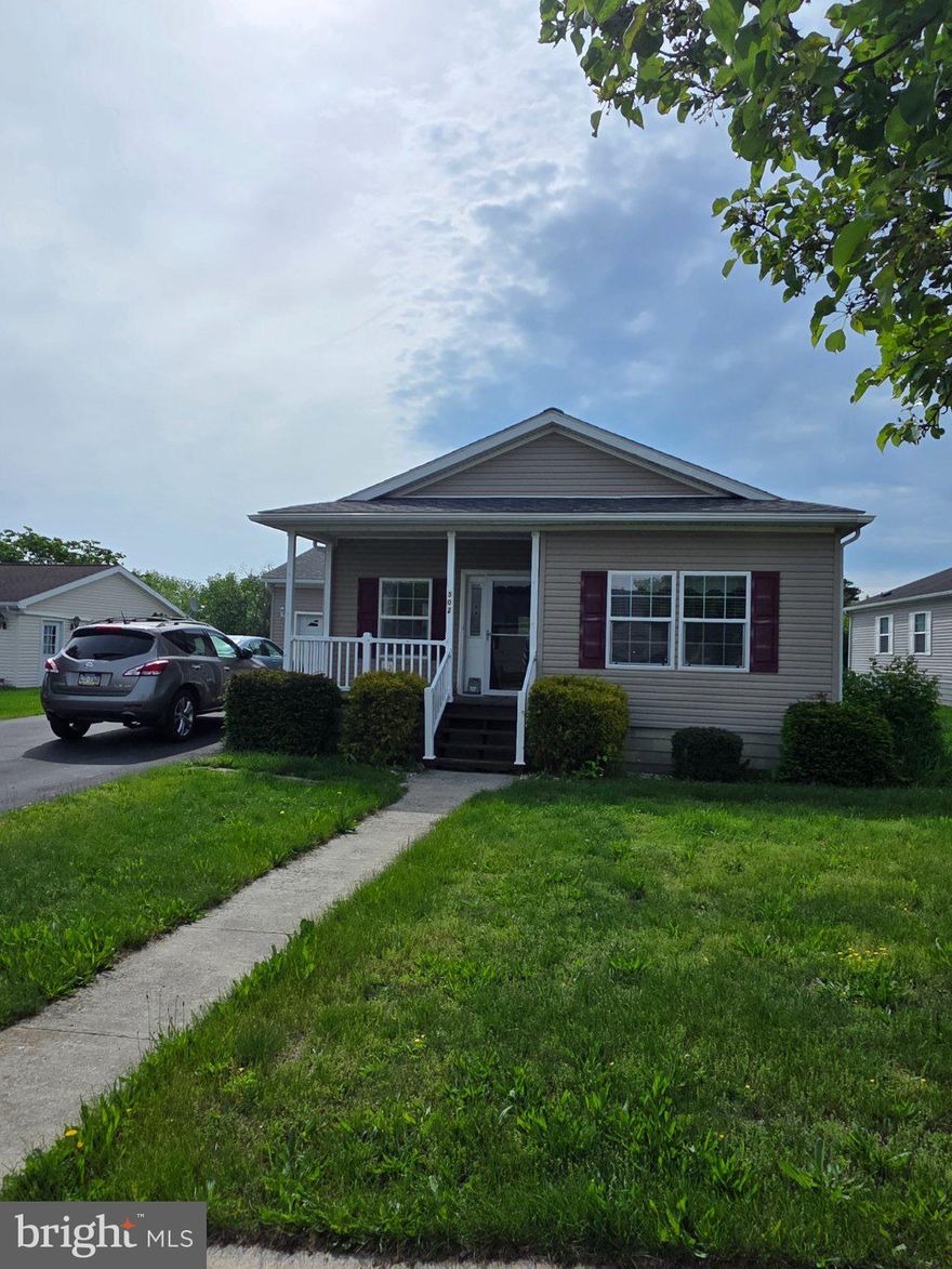 This delightful double-wide manufactured home, built in 2005, offers 1,352 sq. ft. of comfortable living space. Inside, enjoy a bright kitchen with an island, perfect for gatherings, alongside a cozy dining area and spacious living areas adorned with plush carpeting and hardwood flooring. Step outside to find a lovely deck, ideal for enjoying serene mountain views. The community boasts well-maintained sidewalks, streetlights, and a vibrant community fostering connections with neighbors. Conveniently located near parks and local amenities, residents benefit from easy access to recreational activities and essential services. With an attached oversized garage and included appliances like a refrigerator and dishwasher, this home combines comfort and practicality. Embrace a lifestyle of ease and community in this inviting space!