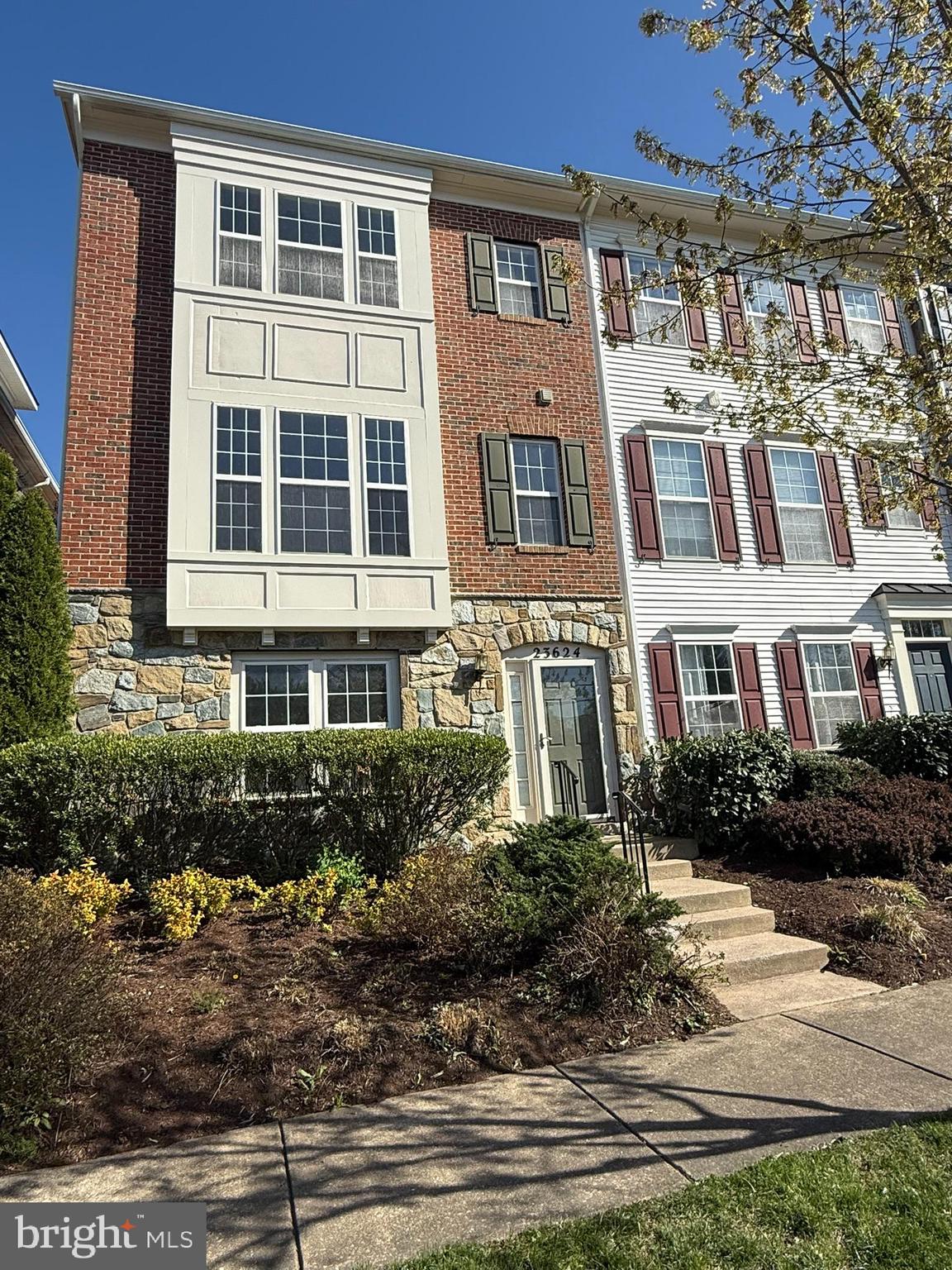 Enjoy this elegant end-unit home in sought-after Clarksburg Town Center. Features include a brick and stone exterior, abundant natural light, bay windows, 42" kitchen cabinets, gas fireplace, 9-foot ceilings, cathedral ceilings in bedrooms, hardwood floors, Berber carpet, and many upgrades. Includes a 2-car garage and is close to the pool, schools, shopping, and I-270.