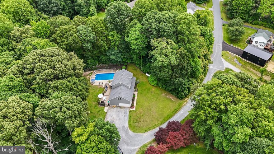 Hilltop Haven with Scenic Views | 4 Bed, 4 Bath | In-Ground Pool & Entertainer’s Basement

Welcome to this stunning 4-bedroom, 4-bath single-family home perched beautifully atop a hill, offering both privacy and panoramic views. Built in 1999 and boasting over 3,000 sqft of thoughtfully designed living space, this home is perfect for families and entertainers alike.

Step inside to find an inviting sunken living room with plush, well-maintained carpet, and a spacious kitchen with original cabinetry, granite countertops, stainless microwave, ceramic flooring, and an extra-large pantry. The master suite features a full ensuite bath and walk-in closet for your ultimate comfort.

Upstairs, enjoy the convenience of laundry in the hall, cable-ready bedrooms, and a versatile bonus room over the garage. The fully finished basement is a showstopper—complete with a custom-built bar with fridge/freezer, built-in speaker system, recessed lighting, crown detailing, indirect lighting, full bathroom, glass display cabinetry, and a pool table—plus walk-out access to the backyard.

Outside, enjoy summer fun in your propane-heated in-ground pool with a brand new liner, Loop Lock safety cover, and owned propane tank. The outdoor patio is perfect for relaxing or hosting, and the yard is maintained with an irrigation system. Recent upgrades include the roof, gutters, windows, garage door, and opener—all just 3 years old. The attached garage features an insulated door for year-round convenience. Vinyl siding comes with a transferable warranty for peace of mind.

No HOA. This hilltop gem blends comfort, charm, and entertainment in one incredible package. Don’t miss your chance to call this home!