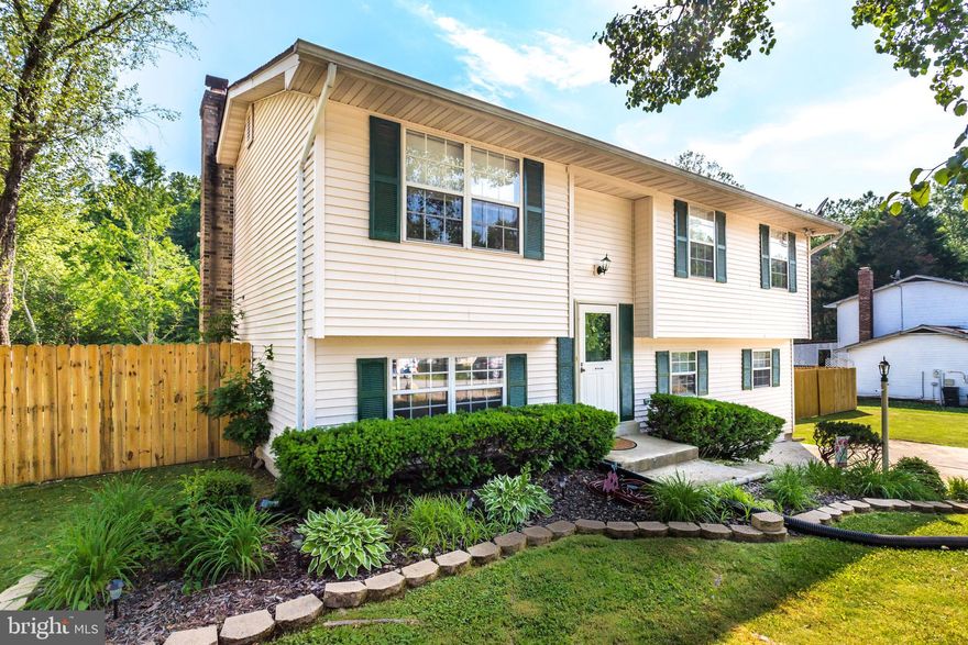 Beautiful home in well established neighborhood. The upper level has brand new flooring throughout with 3 bedrooms and an updated full bath. Nice, bright kitchen, separate dining room and family room. Lower level has a 4th bedroom with large a walk-in closet. There is a second family room area with a wood fireplace, large laundry room and a 2nd full bath. There is no lack of space for entertaining with the upper deck, lower covered deck and large flat back yard. Back yard is fully fenced in with a newer privacy fence. Newer shed in the back for storing lawn equipment. Front and back yard are beautifully landscaped. Great location with for commuters with easy access to Rt. 210 and Rt. 301 and close to restaurants and shopping.