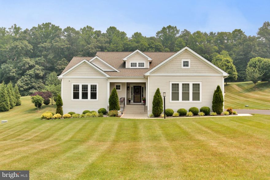 Absolutely stunning home in peaceful neighborhood setting is MOVE IN READY.  Built by Quaker Homes in 2015, this home is much larger that you first realize.  With 3066 finished square feet on main level and a partially finished basement with equal square footage, this home is just over 6000 Sf in total.  Privacy abounds with this large open lot.  Home is situated off the main road and boasts a 3 car garage.  Enter in the front door into a wide center hall that leads directly to living room beautifully appointed with a fireplace.  3 bedrooms and 2 full baths are to your left from the center hall and to the right off the center hall is pantry and continue on to a large gourmet kitchen with an enormous island, breakfast area, loads of cabinets and counter space and this area opens to the proper dining room with lots of windows and natural light.  Continue to the back of the house is the Primary Suite with adjacent office.  This office space could alternately become a family room/sunroom. a lovely deck can be accessed from Dining room or office space.  Additional features include Bluetooth speakers in Primary bedroom/bath, living room, breakfast area, kitchen and garage.  Fios is available.
On the lower level is a partially finished space with large windows, French doors, and a rough in bathroom.  This area is perfect for craft space, or a workshop, or home gym or just use it as extra storage.  There is plenty of room.   This home will not disappoint!  It is turn key so hurry and make it yours!!
(see iguide for floor plan and room dimensions)