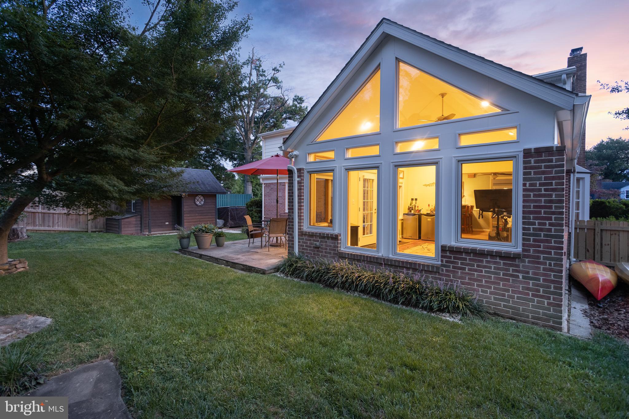Classic brick Cape Cod offering timeless charm, modern updates, and a private backyard retreat. A brick walkway and mature landscaping set the tone, leading into a bright main level with hardwood floors, a cozy fireplace insert, and a formal dining room. The highlight of the home is the vaulted sunroom, featuring cathedral ceilings and walls of windows that flood the space with natural light and overlook the beautifully landscaped backyard. The kitchen connects seamlessly to the living areas, making it ideal for both everyday living and entertaining.
Upstairs, the spacious primary suite features a walk-in closet and a fully renovated bathroom with tile, a glass shower, and a dual vanity. Additional bedrooms provide flexibility for family, guests, or home office space, while a second full bath on the main level offers convenience. The finished lower level expands the living space with a large recreation room, a dedicated workshop, a laundry area, and abundant storage.
Step outside to a serene backyard complete with a stone patio, mature trees, a koi pond, and a stone retaining wall, creating the perfect setting for outdoor gatherings. A detached shed provides additional storage or hobby space. Move-in ready and thoughtfully updated, this home balances character, comfort, and functionality in one of the area’s most desirable neighborhoods.