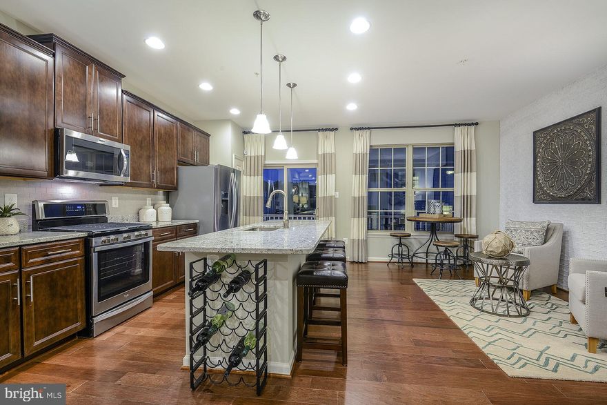 Brand new full brick front,2 car rear garage,  cathedral ceilings, upgraded garden bath in owners suite, 3 BR 3.5 bath, hardwood, oak stair first to second floor, open rails throughout, wood throughout main kitchen level, stainless appliances, gas range. March delivery. Closing assistance available with use preferred title/lender.